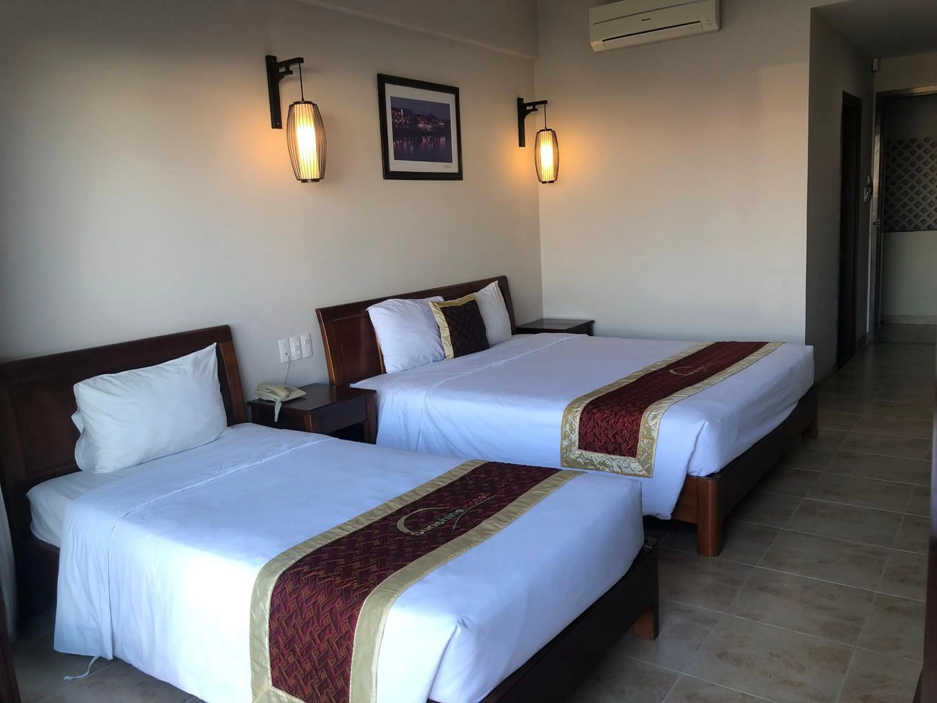 Bed in Sunshine Hoian Hotel