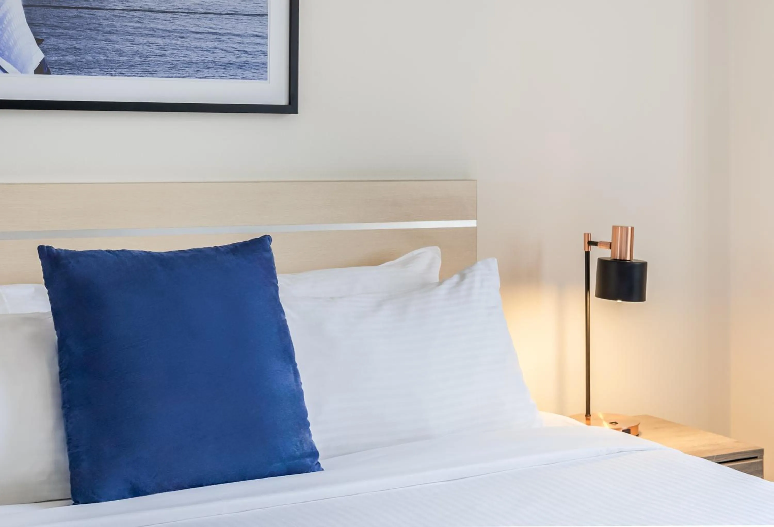 Bed in Oaks Sydney Castlereagh Suites