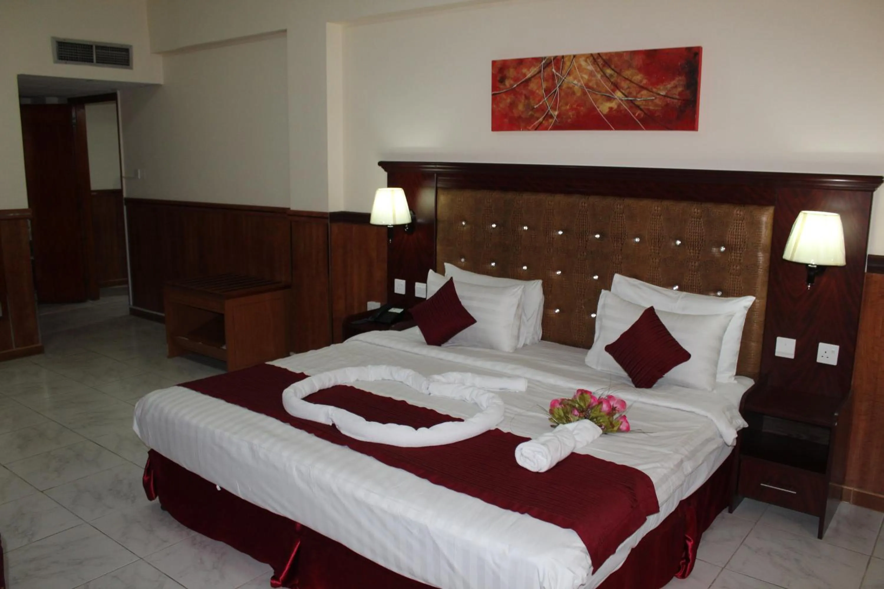 Bed in Grand Nova Hotel
