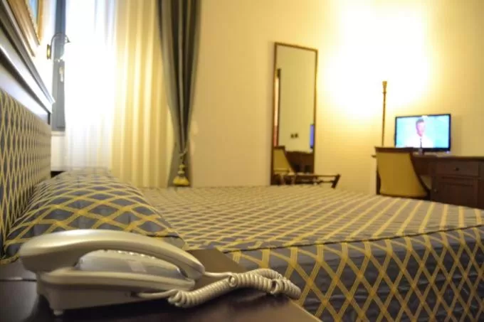 Bed in Hotel Don Carlo