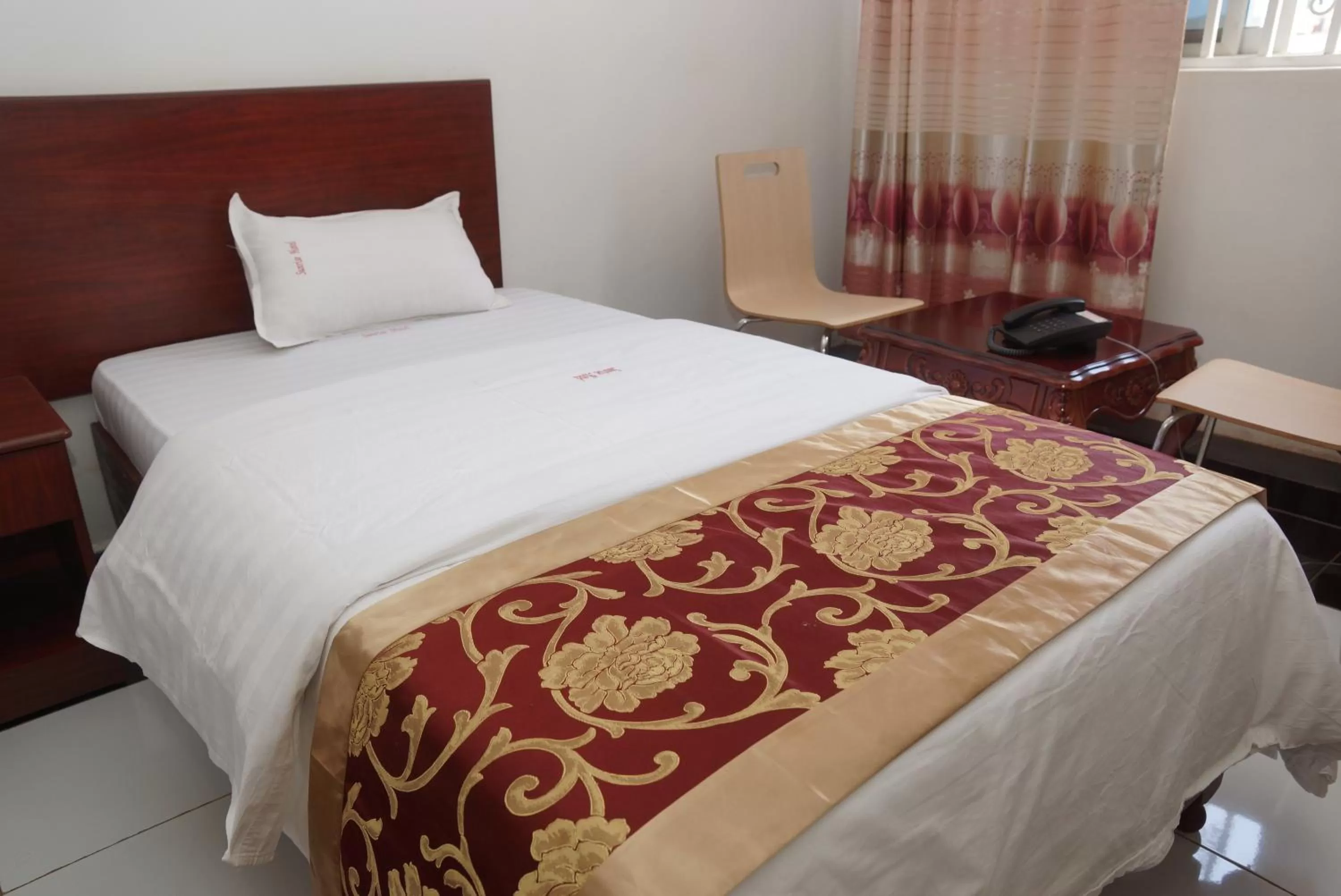 Bed in Sunrise Hotel Kampala