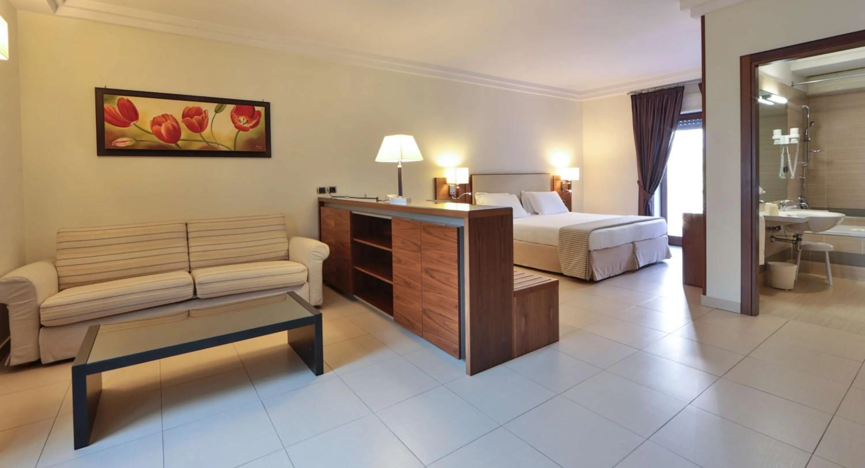 Bed in Suites & Residence Hotel