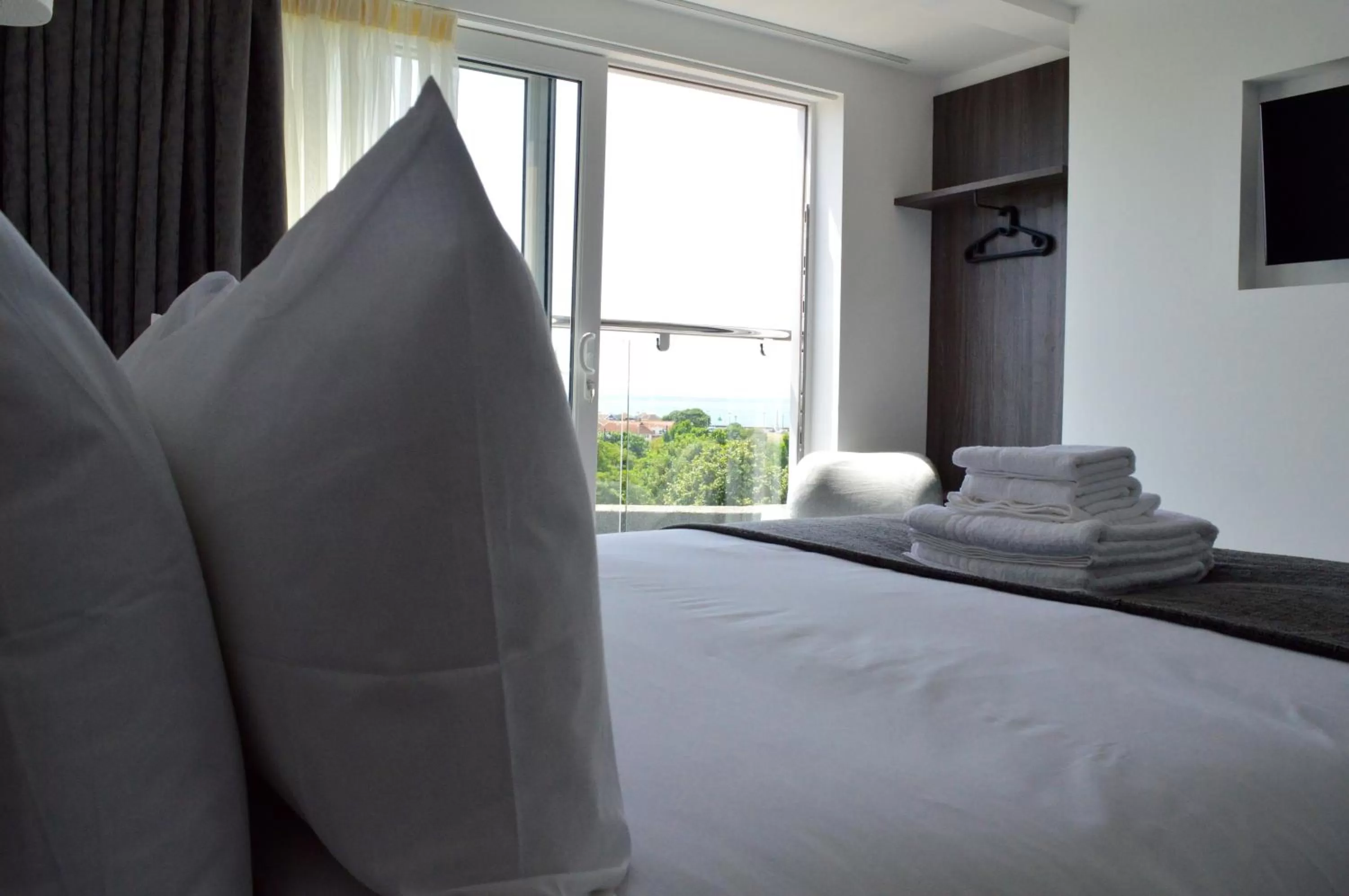 Bed in Q8 Boutique Hotel