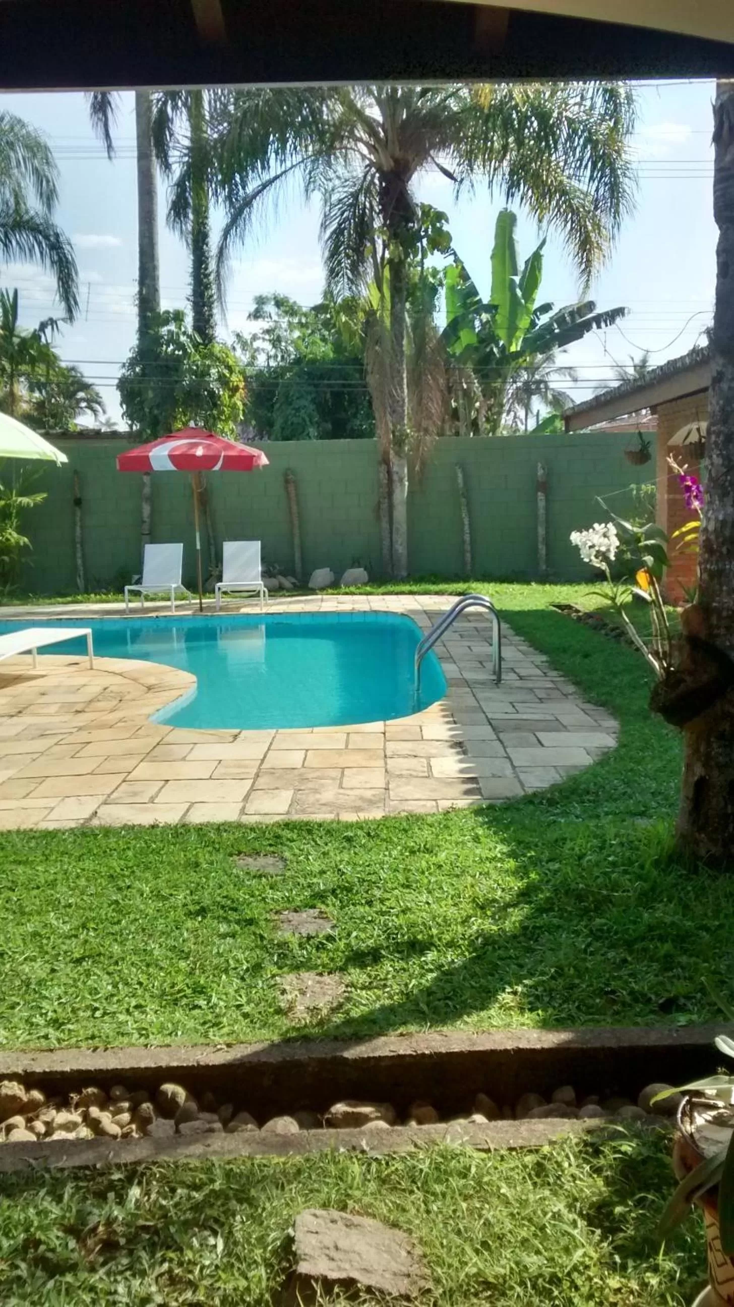Swimming pool in Pousada Na Praia Ubatuba