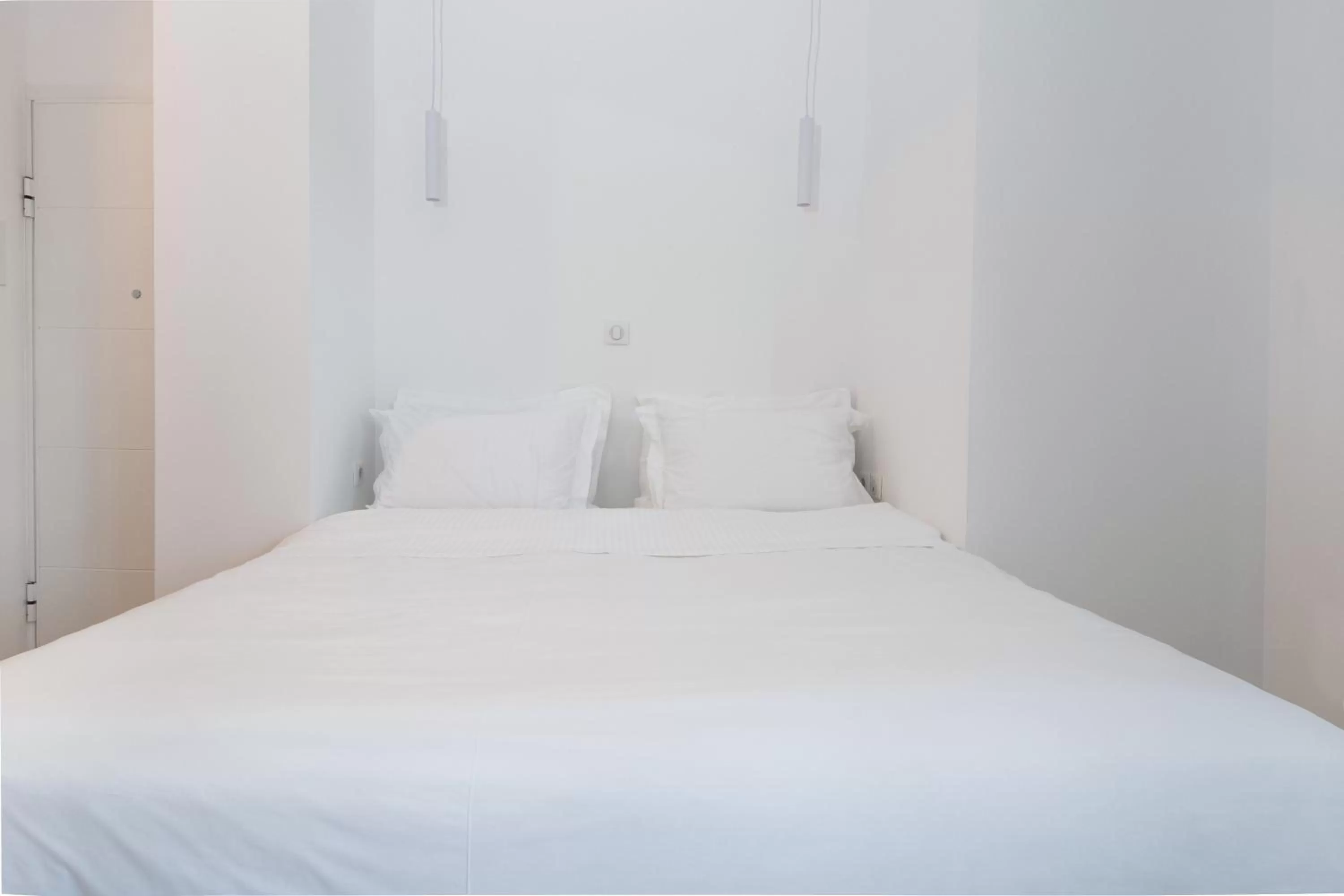 Bed in Clocktower Luxury Suites