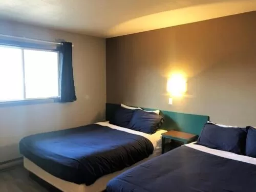 Bed in The Canterbury Inn of Downtown Invermere