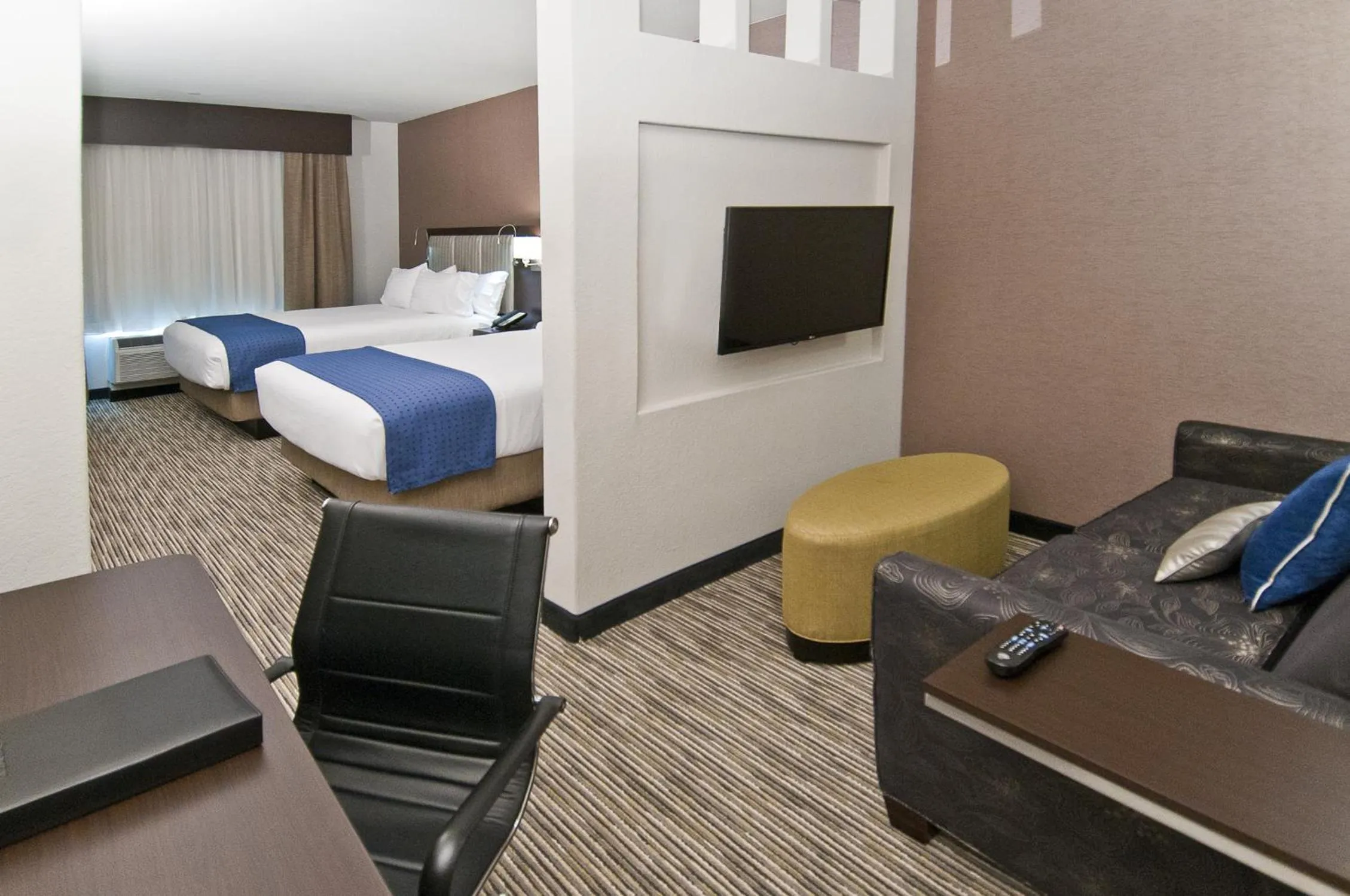 Seating area, Bed in Holiday Inn Austin Airport by IHG