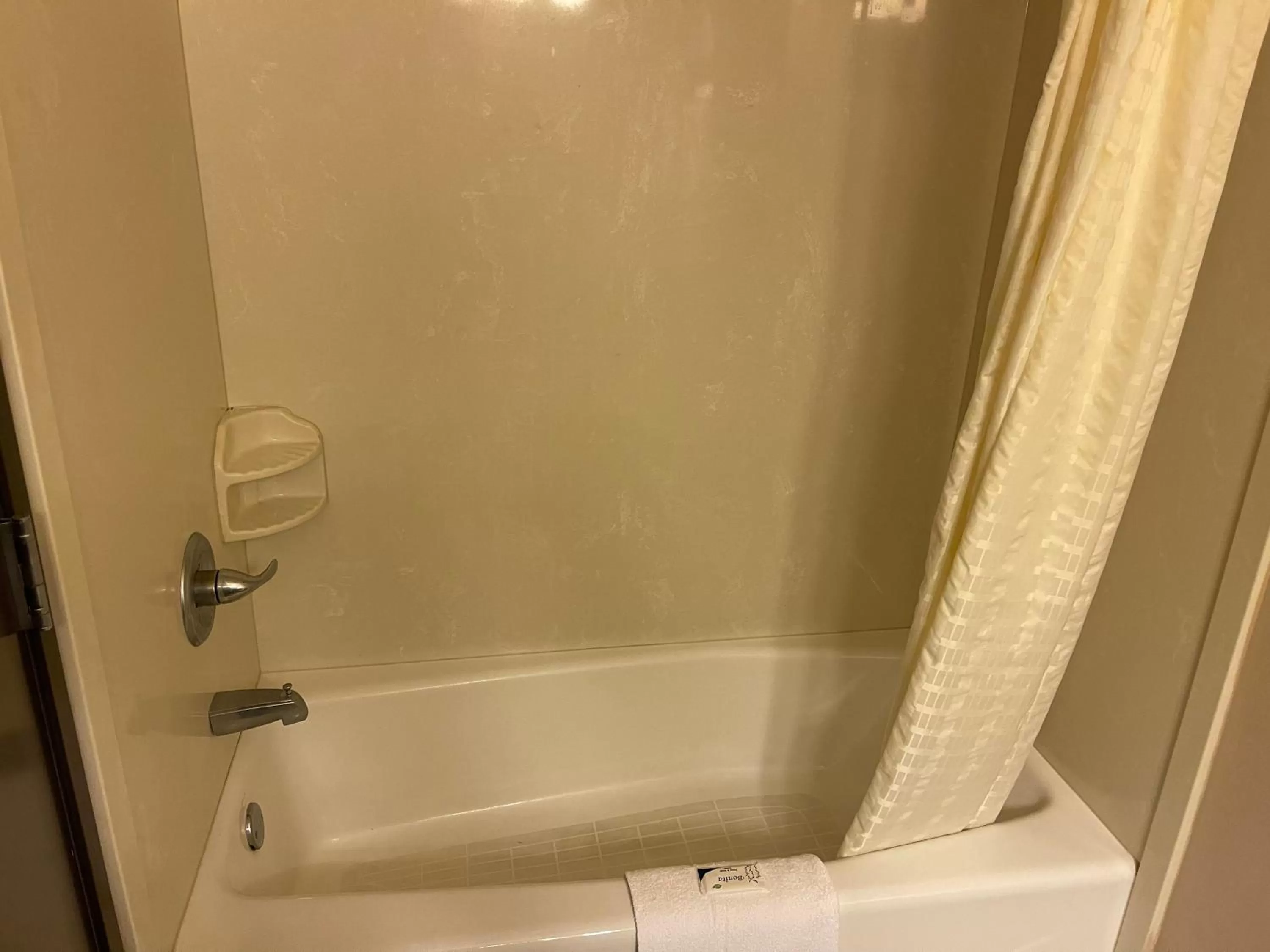 Bathroom in Super 6 Inn & Suites