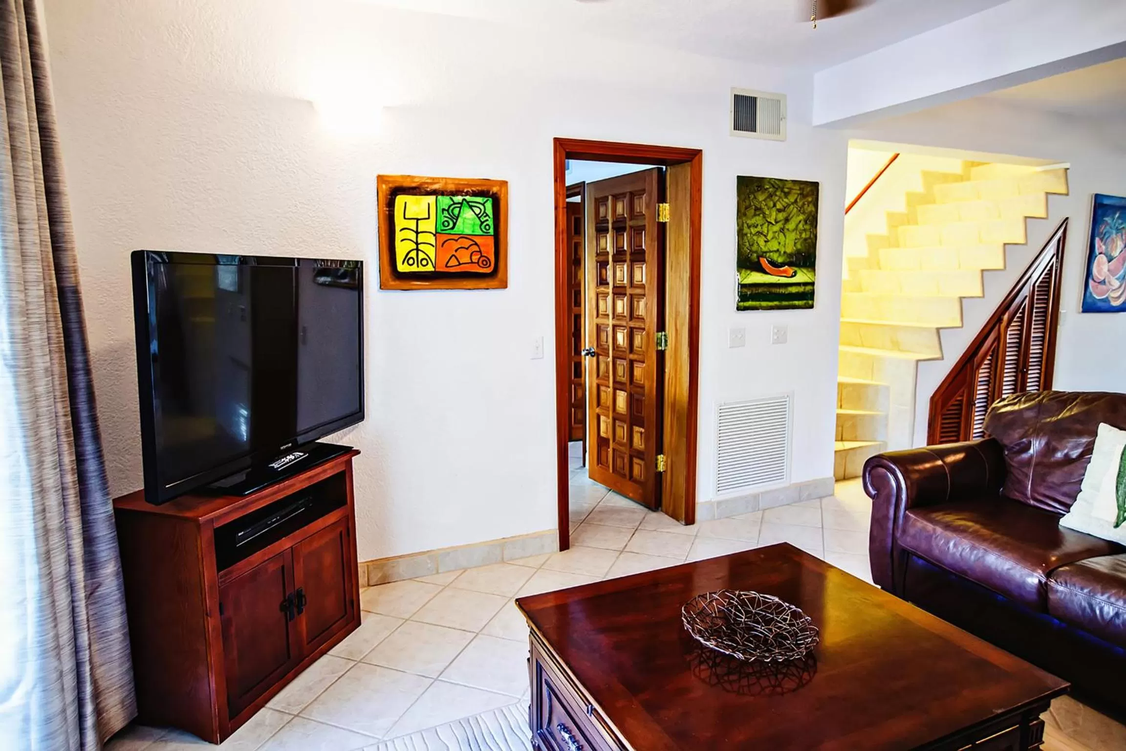 Living room, TV/Entertainment Center in Pelican Reef Villas Resort