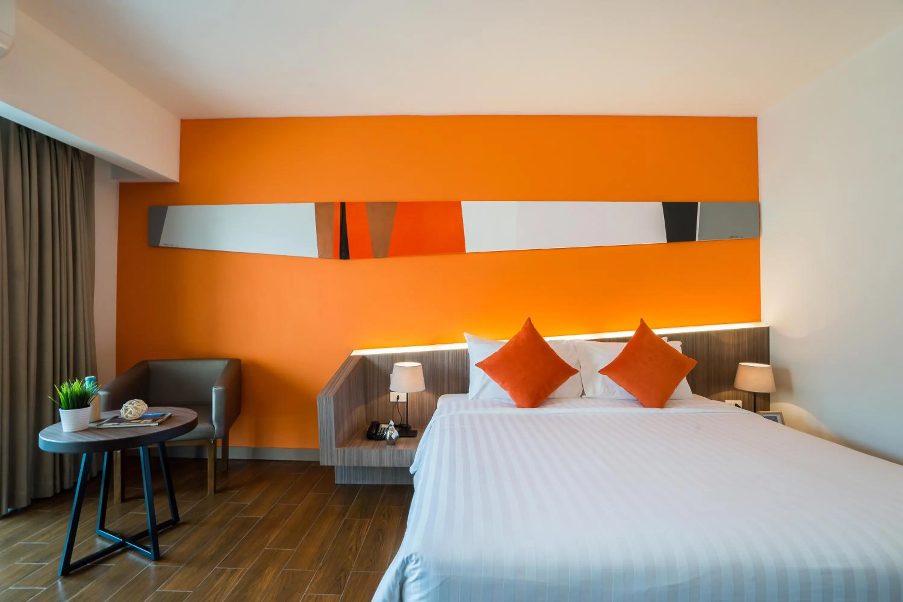 Bed in J Inspired Hotel Pattaya