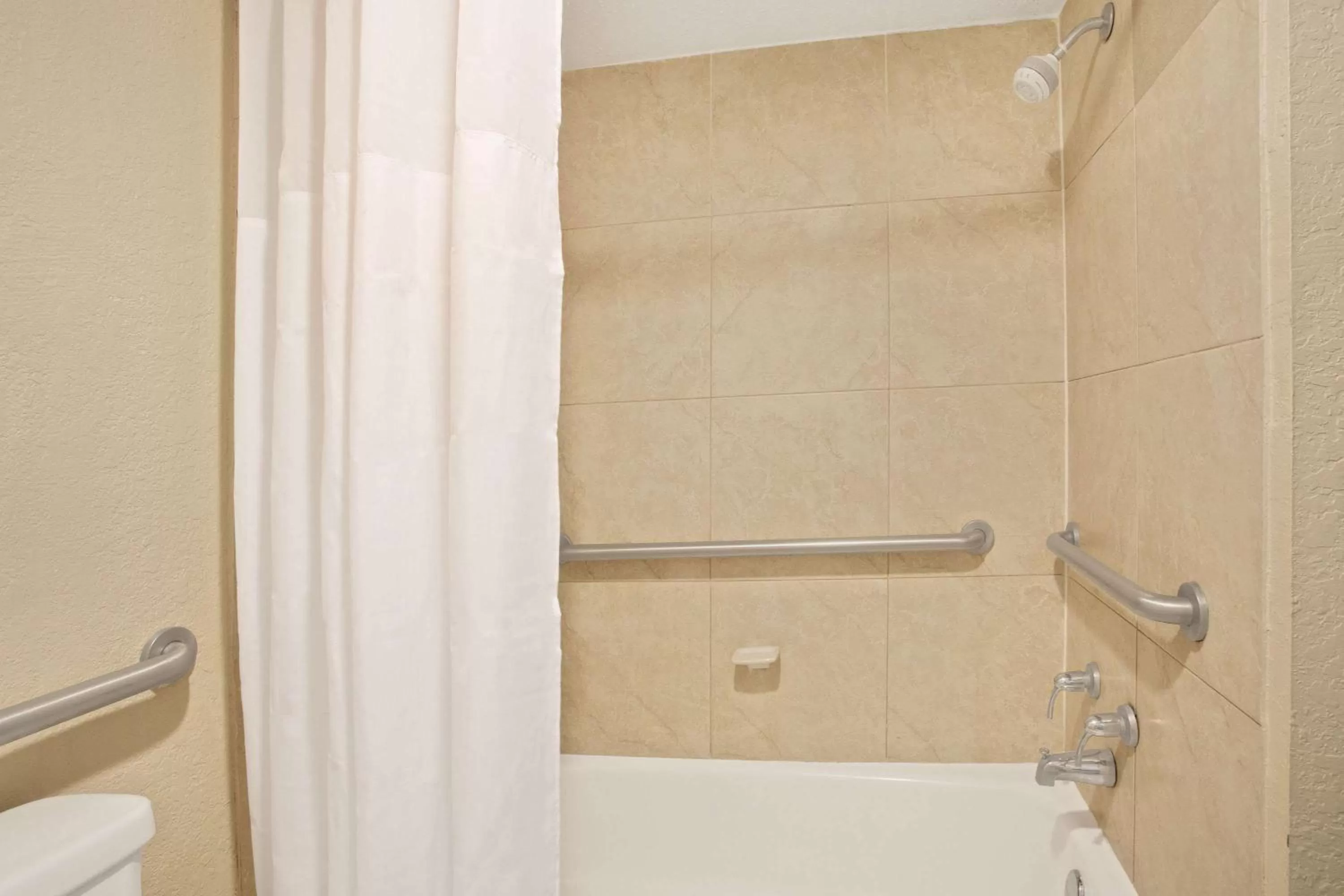 Bathroom in Days Inn by Wyndham Orlando Airport Florida Mall