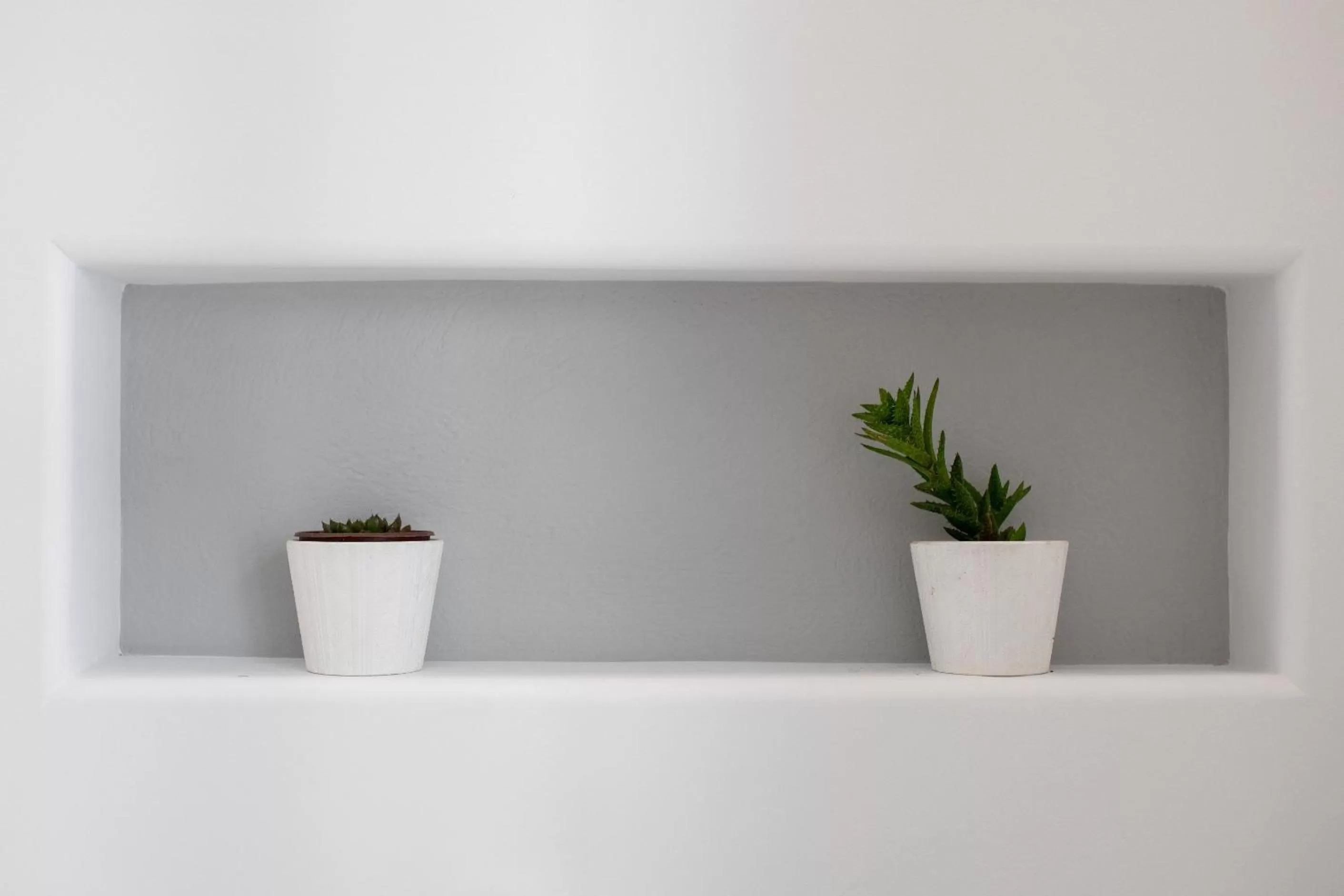 Bed in Arco Naxos Luxury Apartments