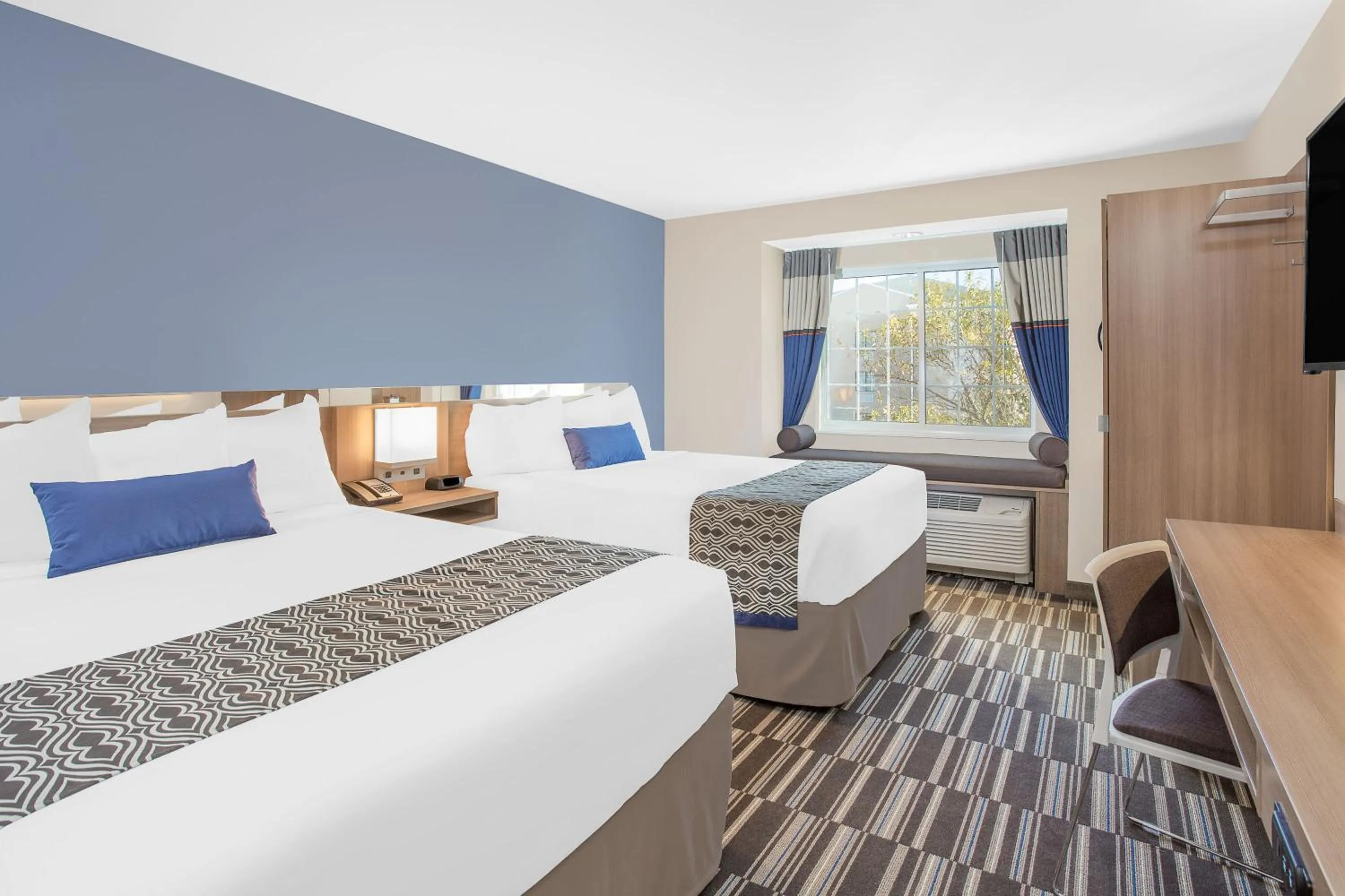Bed in Microtel Inn & Suites by Wyndham Ocean City