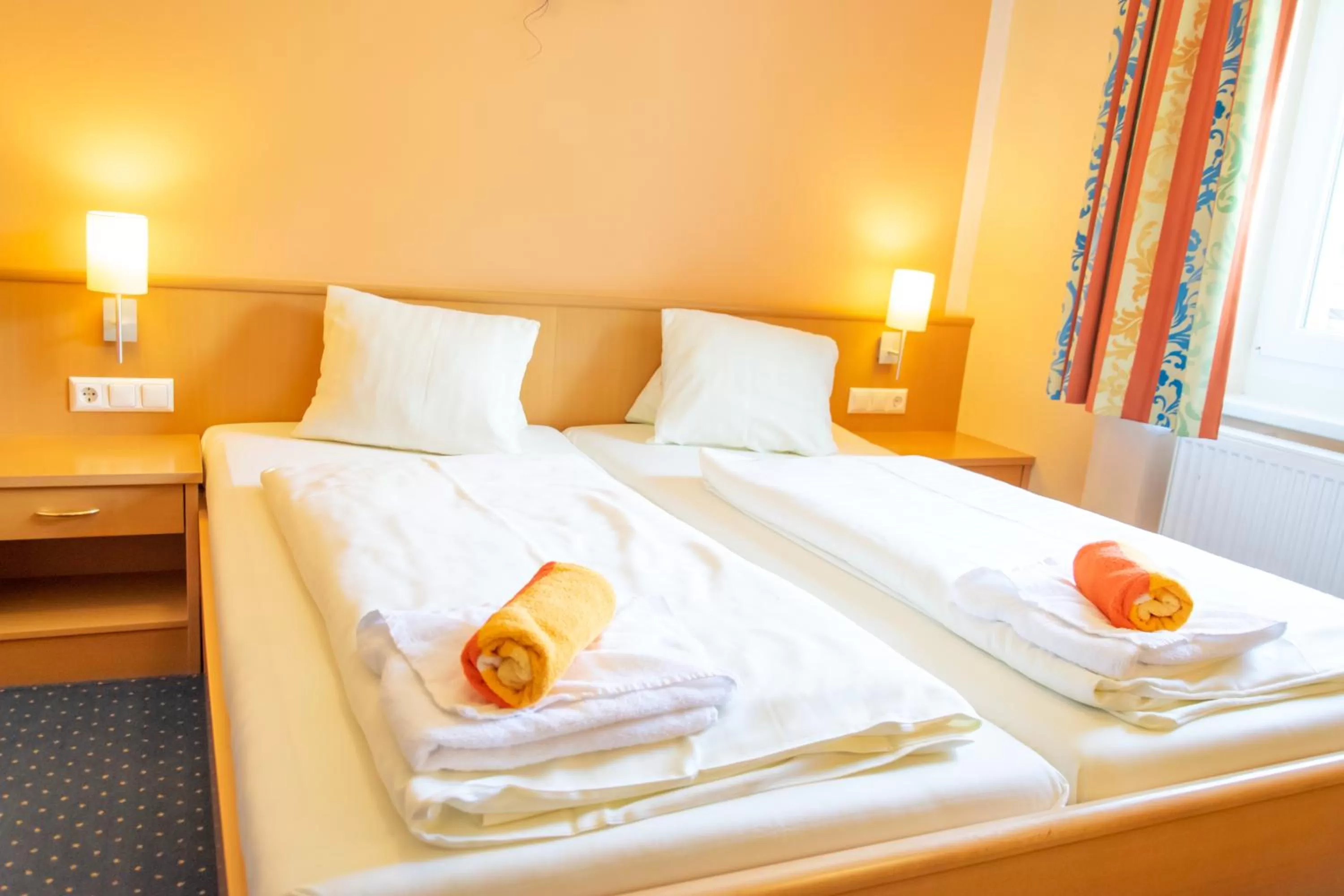 Photo of the whole room, Bed in Strandhotel Burgstaller