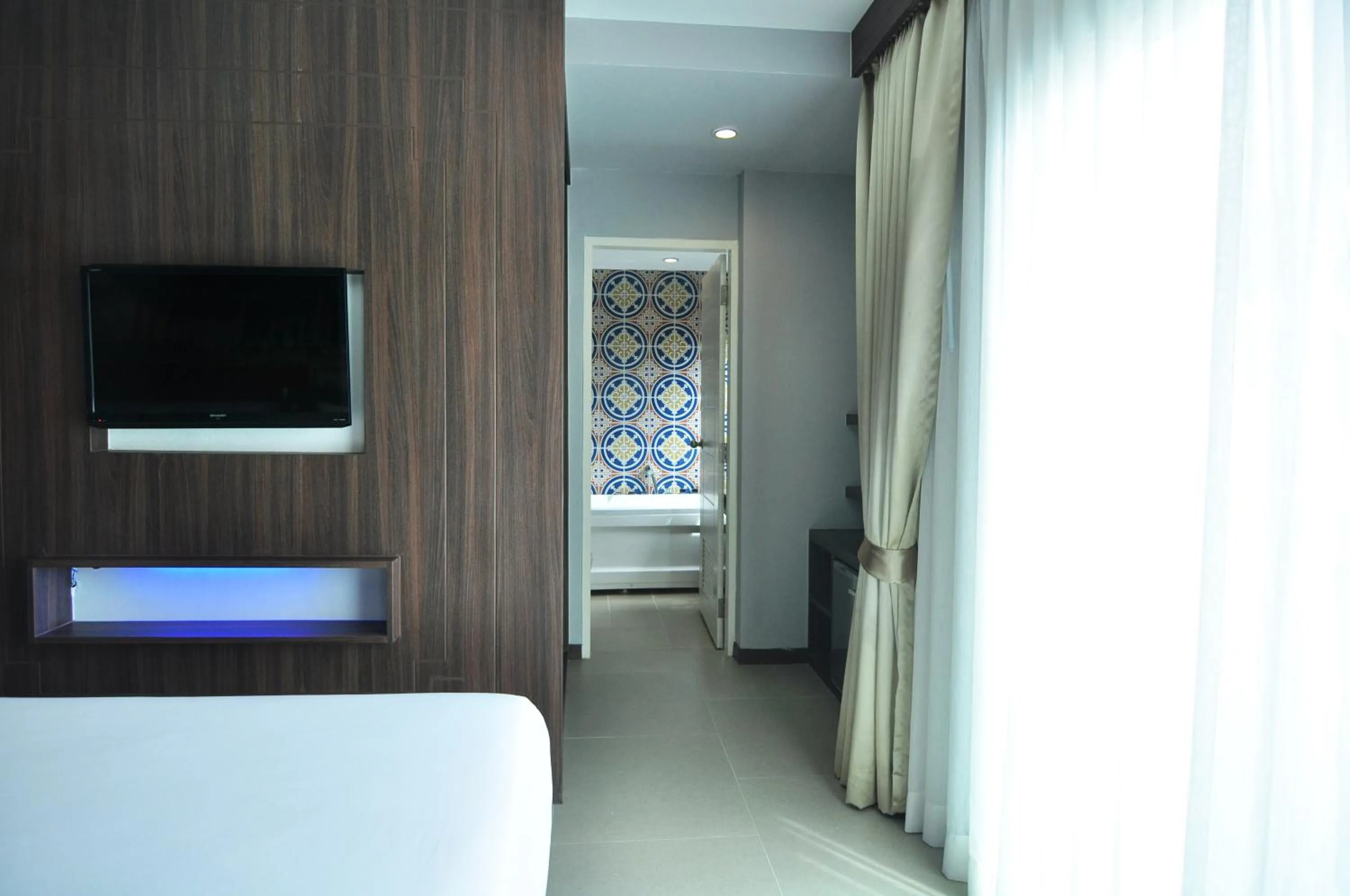 Photo of the whole room, Bed in The AIM Patong Hotel