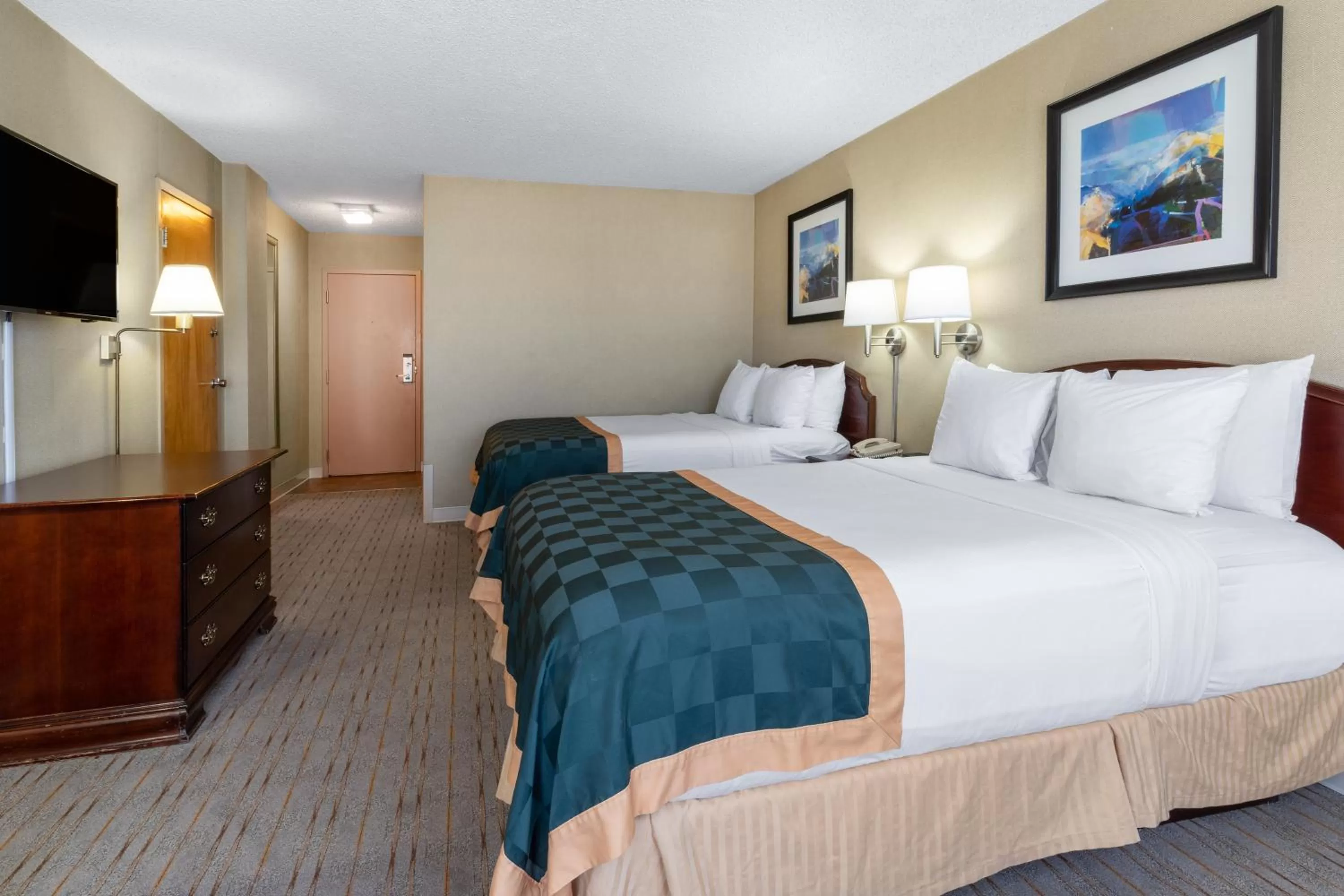 Bed in Ramada by Wyndham Reno Hotel & Casino