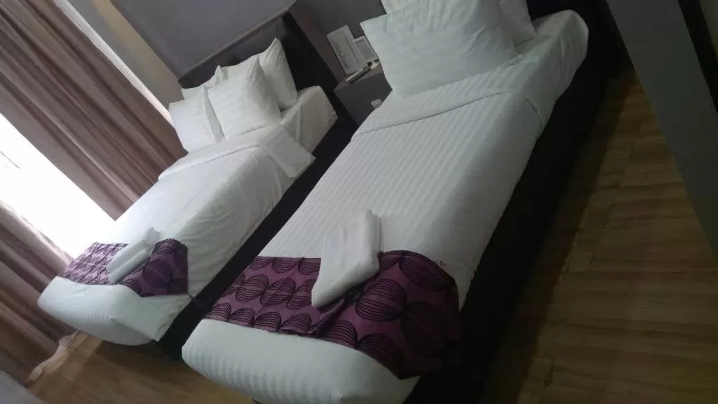 Bed in Sunset Villa Inn