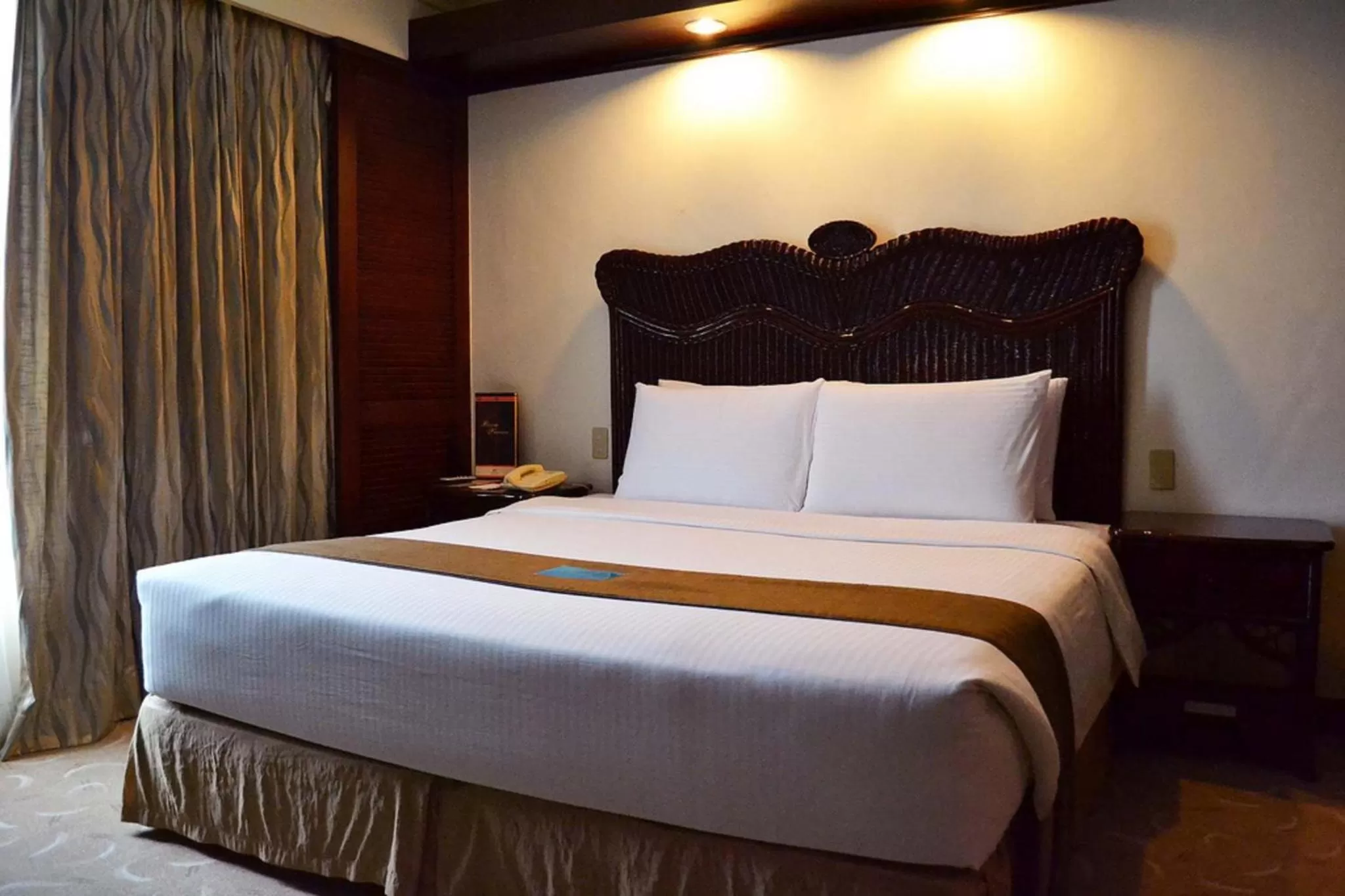 Bed in Waterfront Airport Hotel and Casino