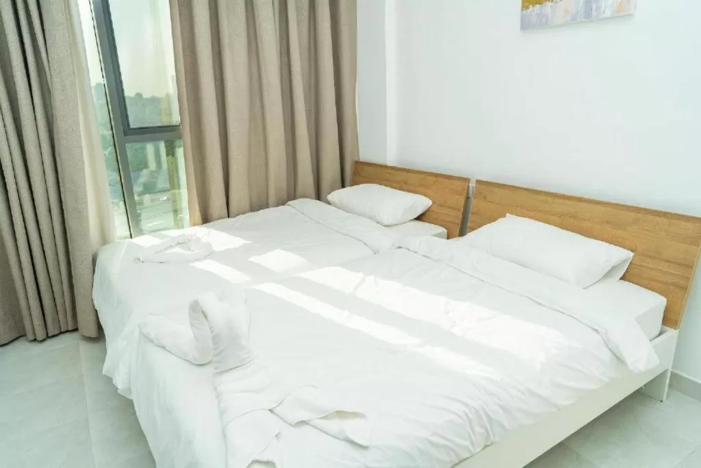 Bed in Atlantis Suites Hotel