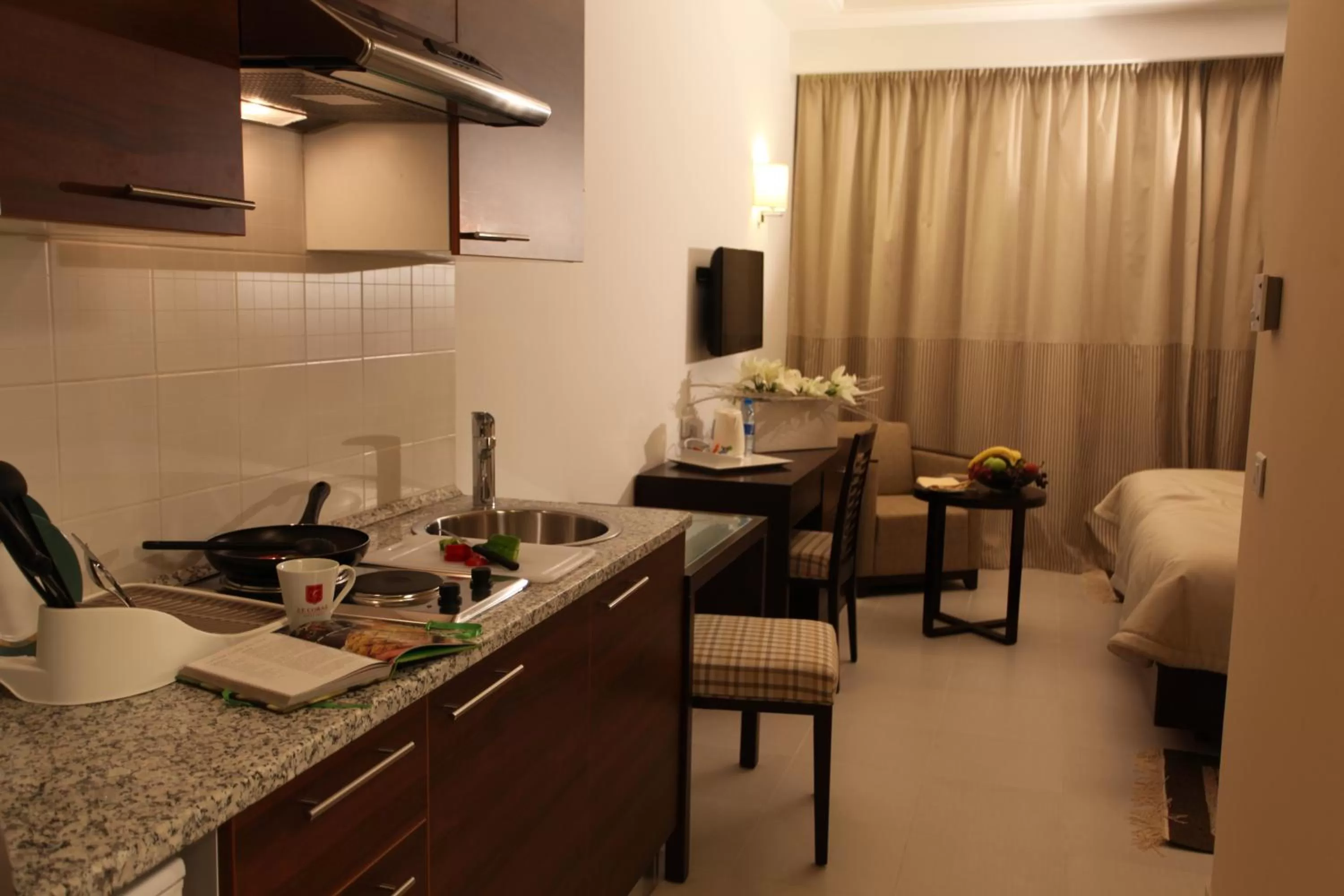 Kitchen or kitchenette in Le Corail Suites Hotel