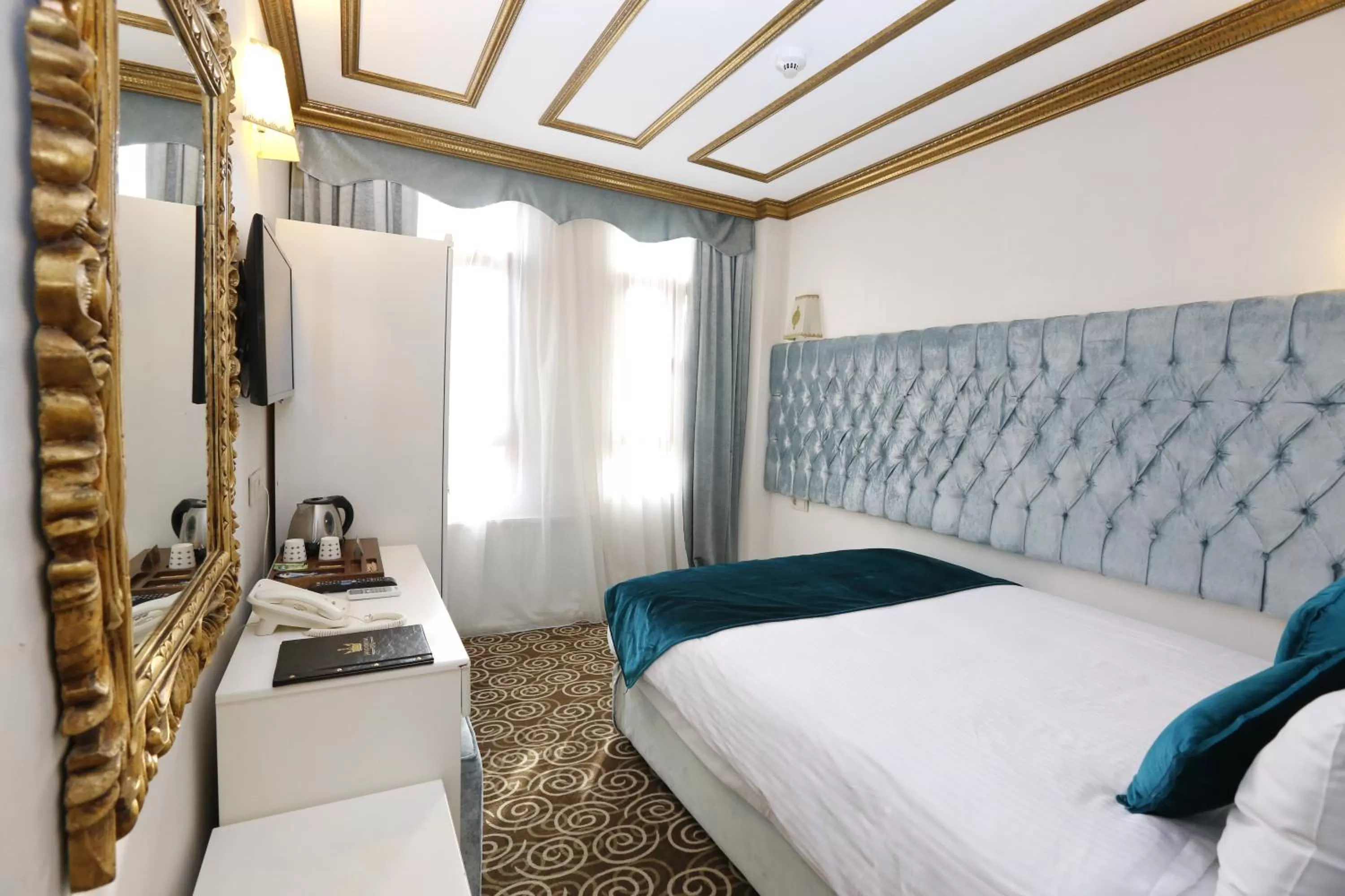 Bed in Diamond Royal Hotel