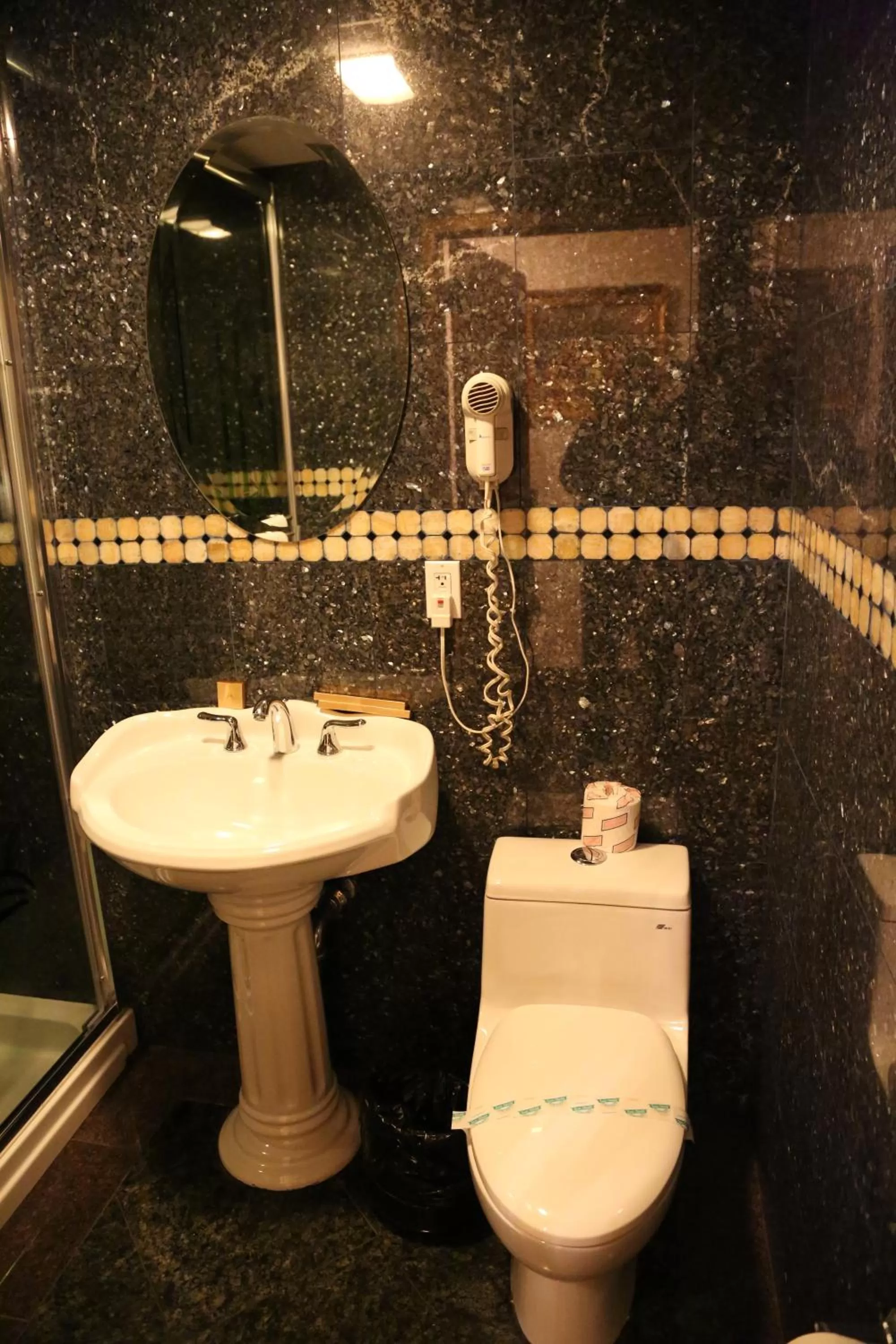 Bathroom in Paris Suites Hotel