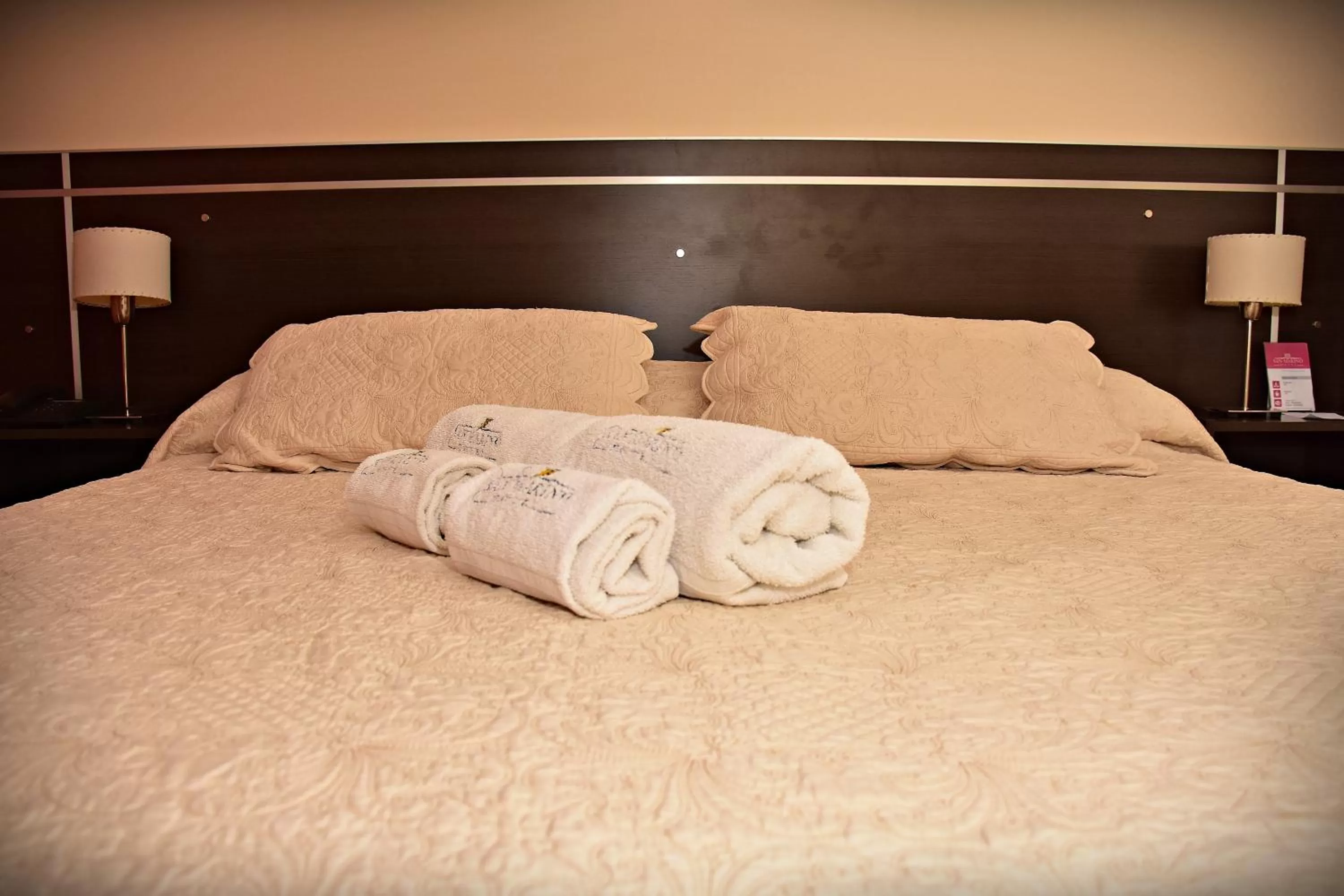 Bed in Hotel San Marino