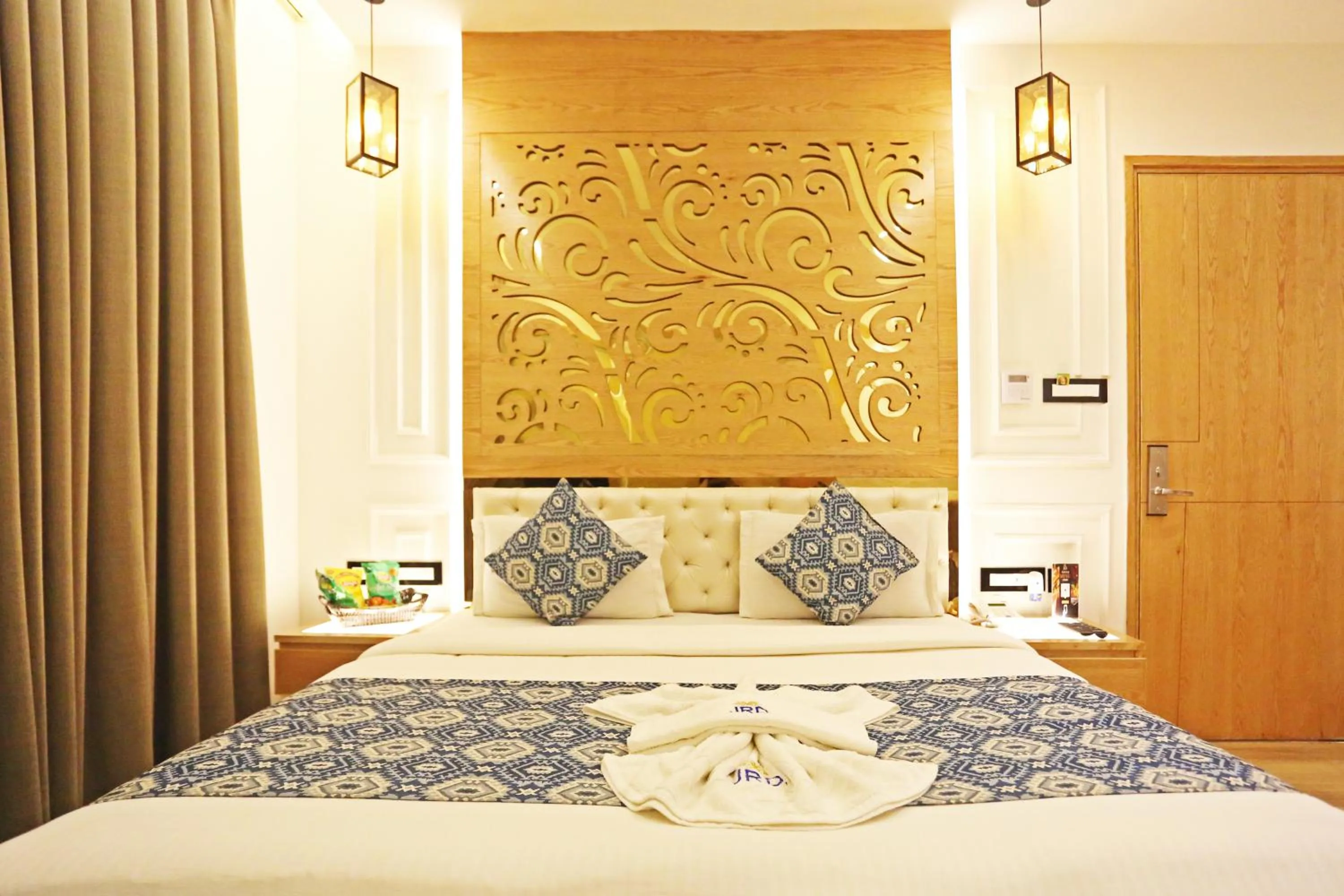 Bed in JRD Luxury-Business Hotel