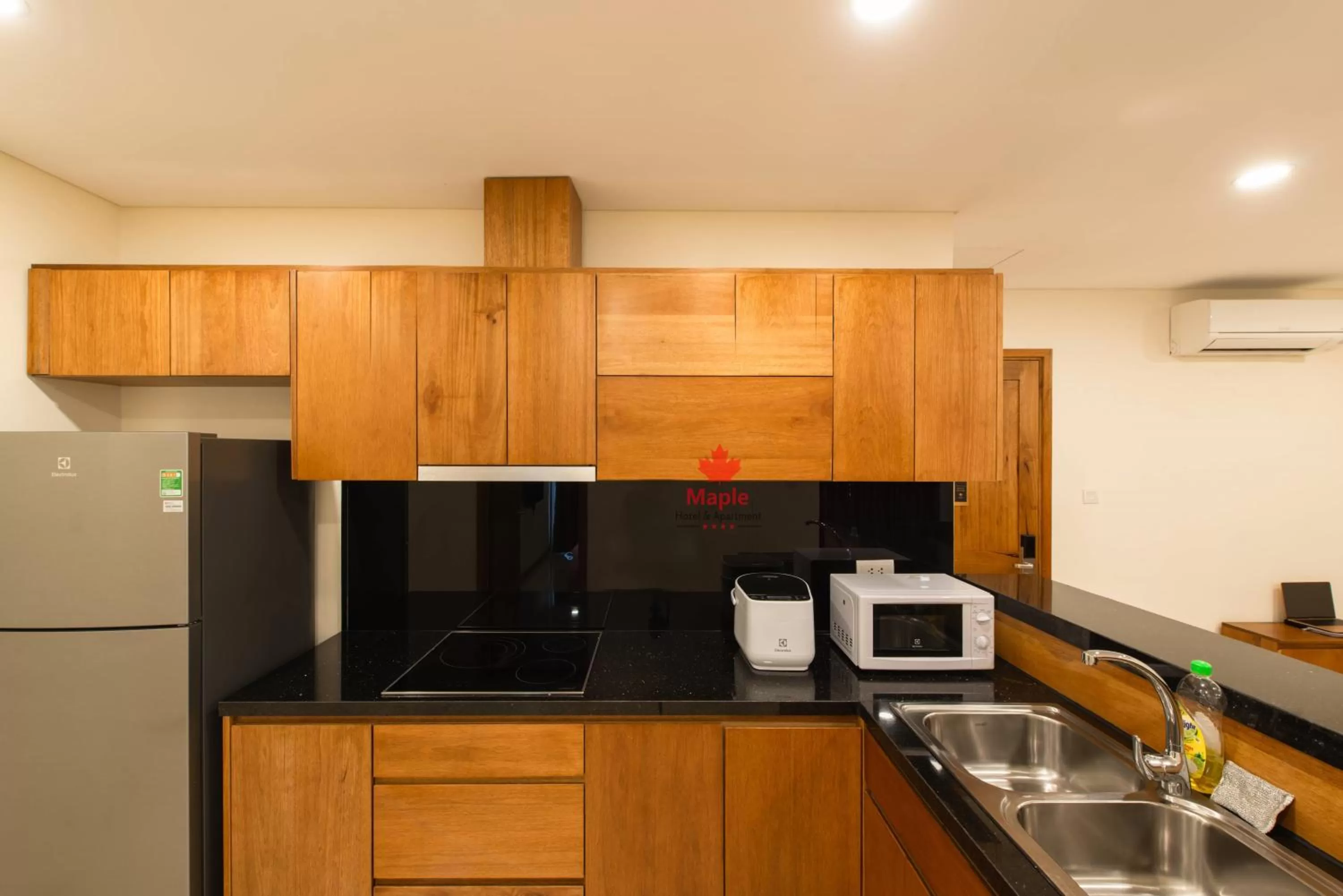 Kitchen or kitchenette in Maple Hotel & Apartment