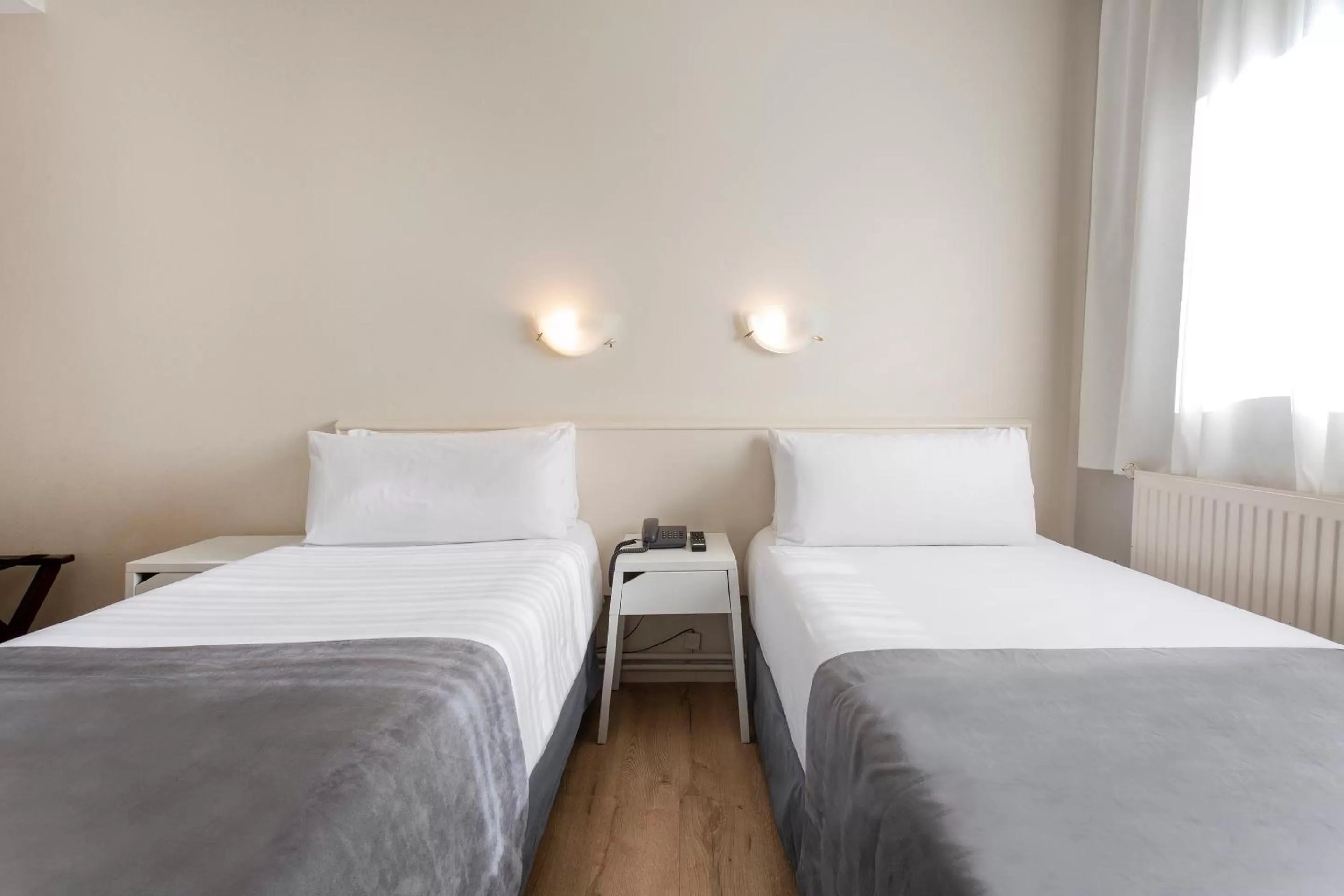 Bed in Hotel Camellot by Nexta