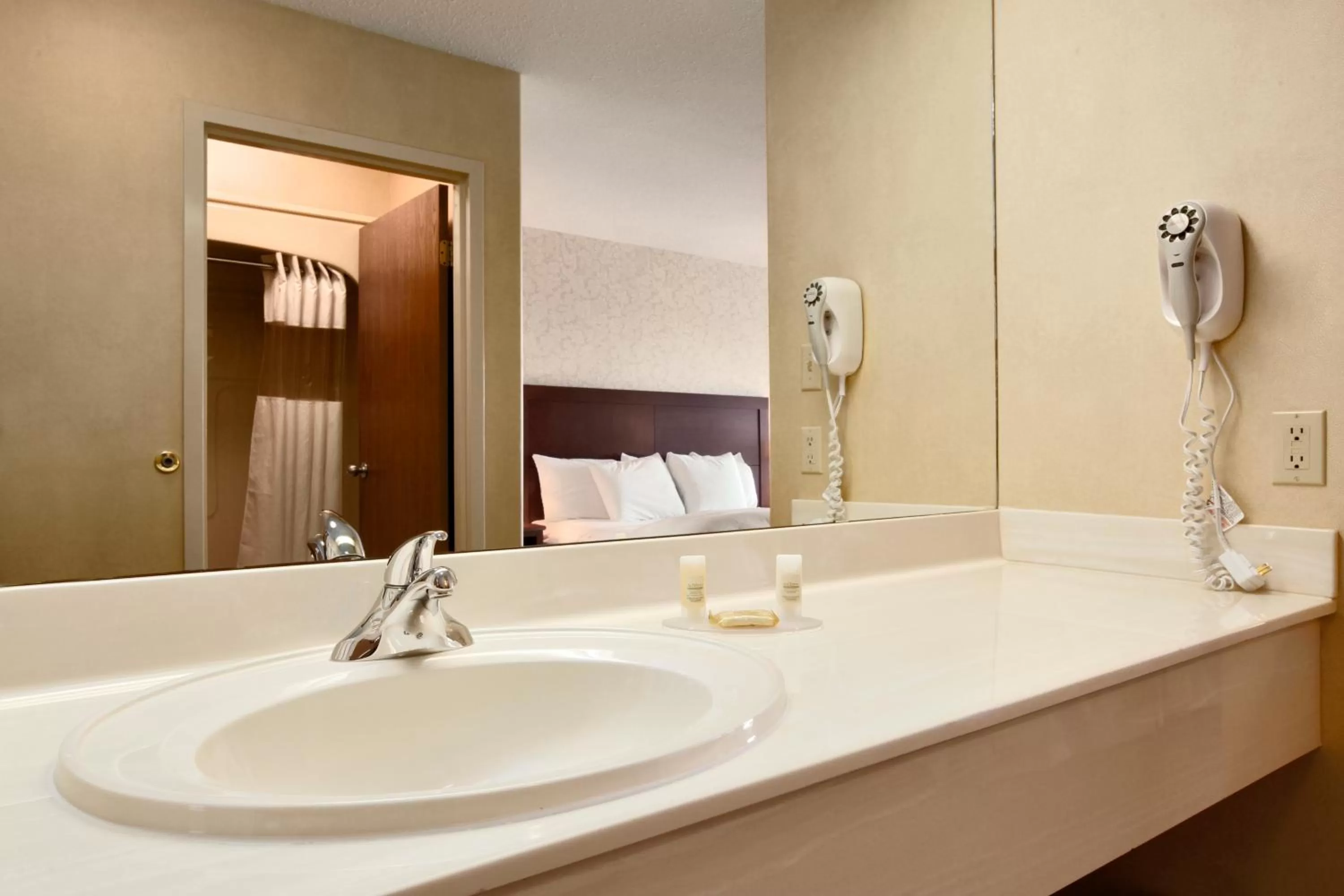 Bathroom, Bed in Days Inn & Suites by Wyndham Brandon