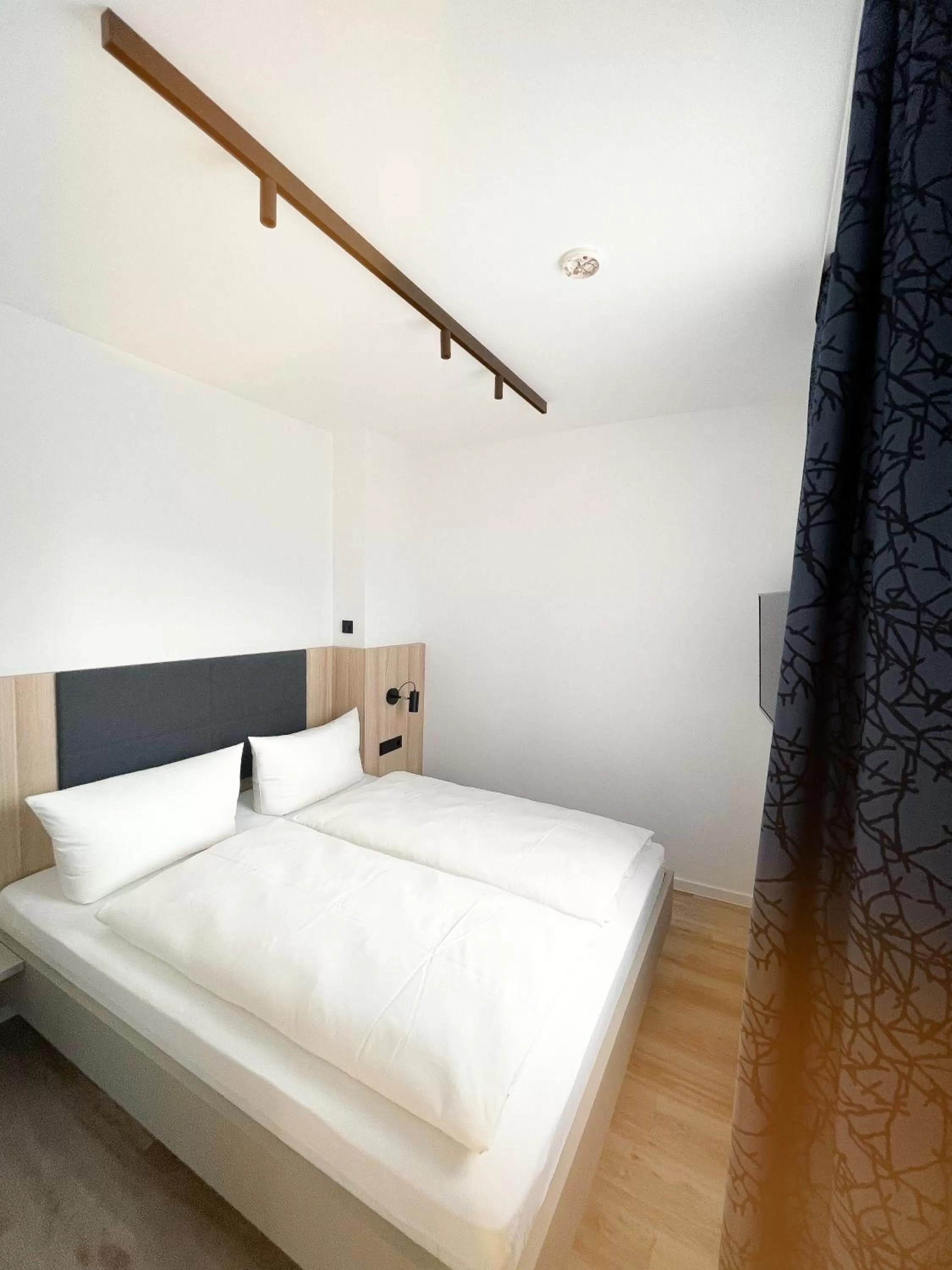 Bed in HOLI City Apart Hotel Berlin