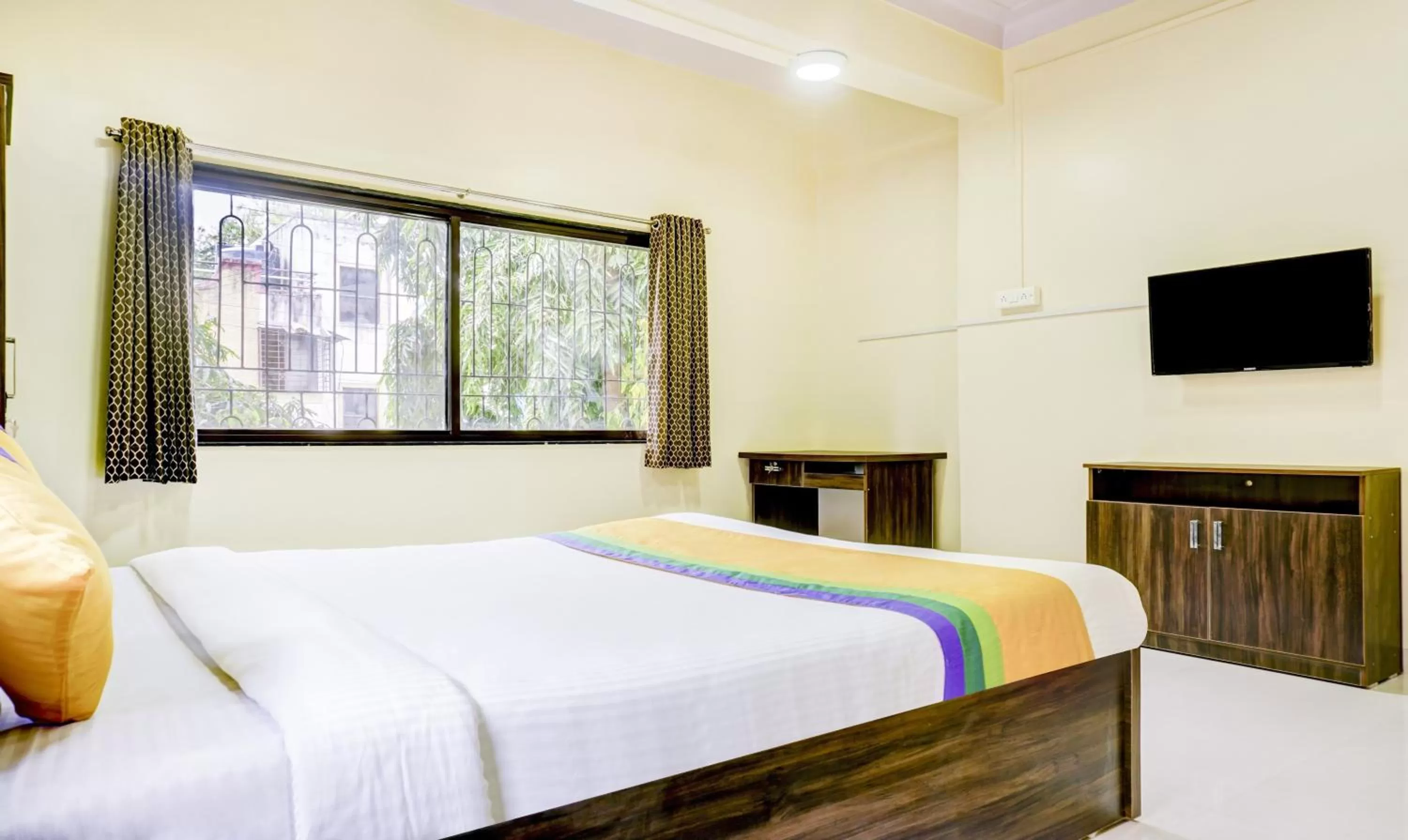 TV and multimedia, Bed in Hotel Bestow Inn Koregaon Park Pune -Near Osho Ashram