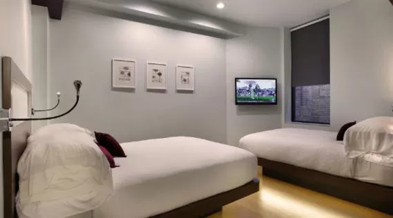 Bed in CityFlatsHotel - Grand Rapids, an Ascend Collection Hotel