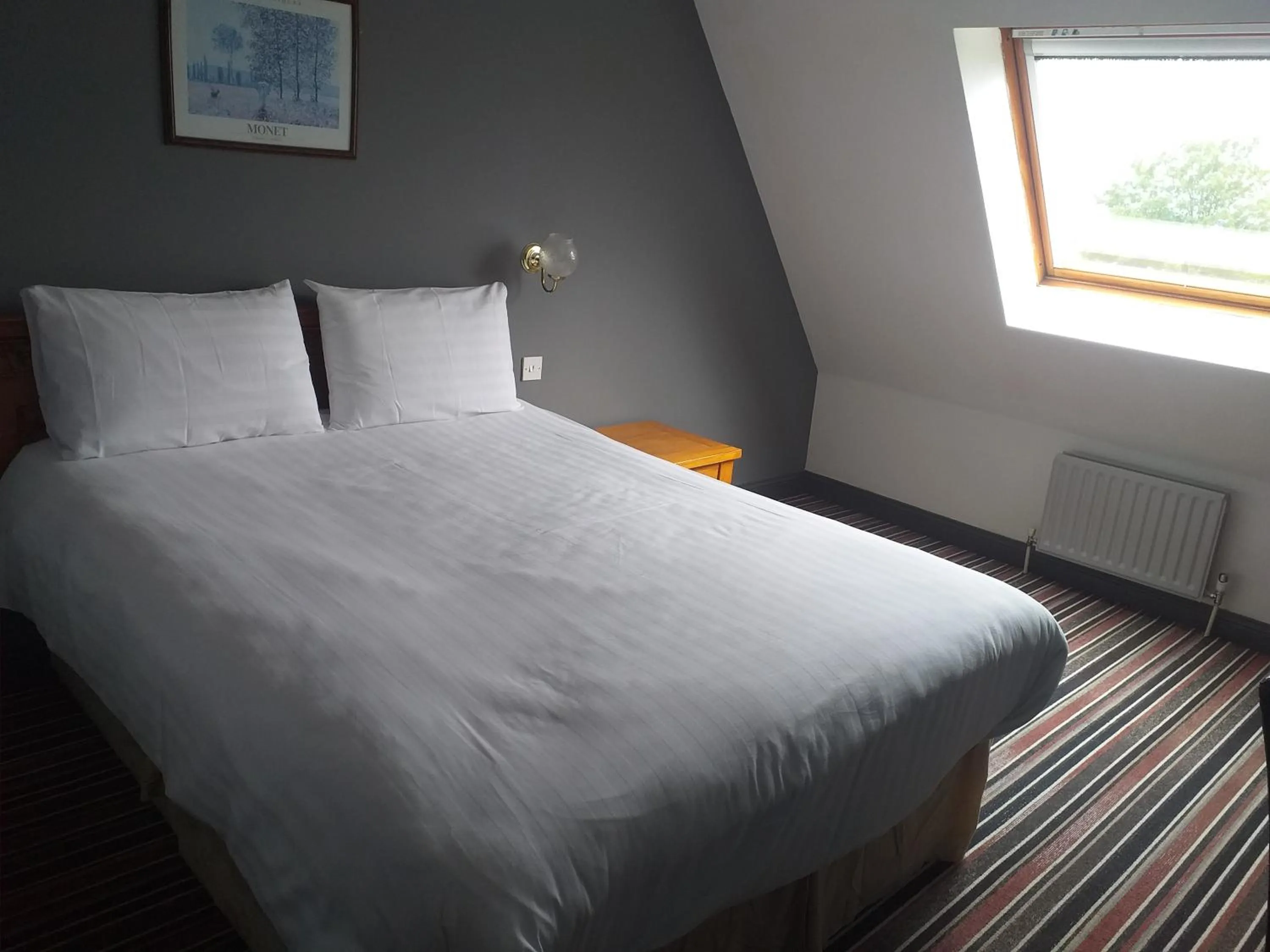 Bed in The Airman Hotel