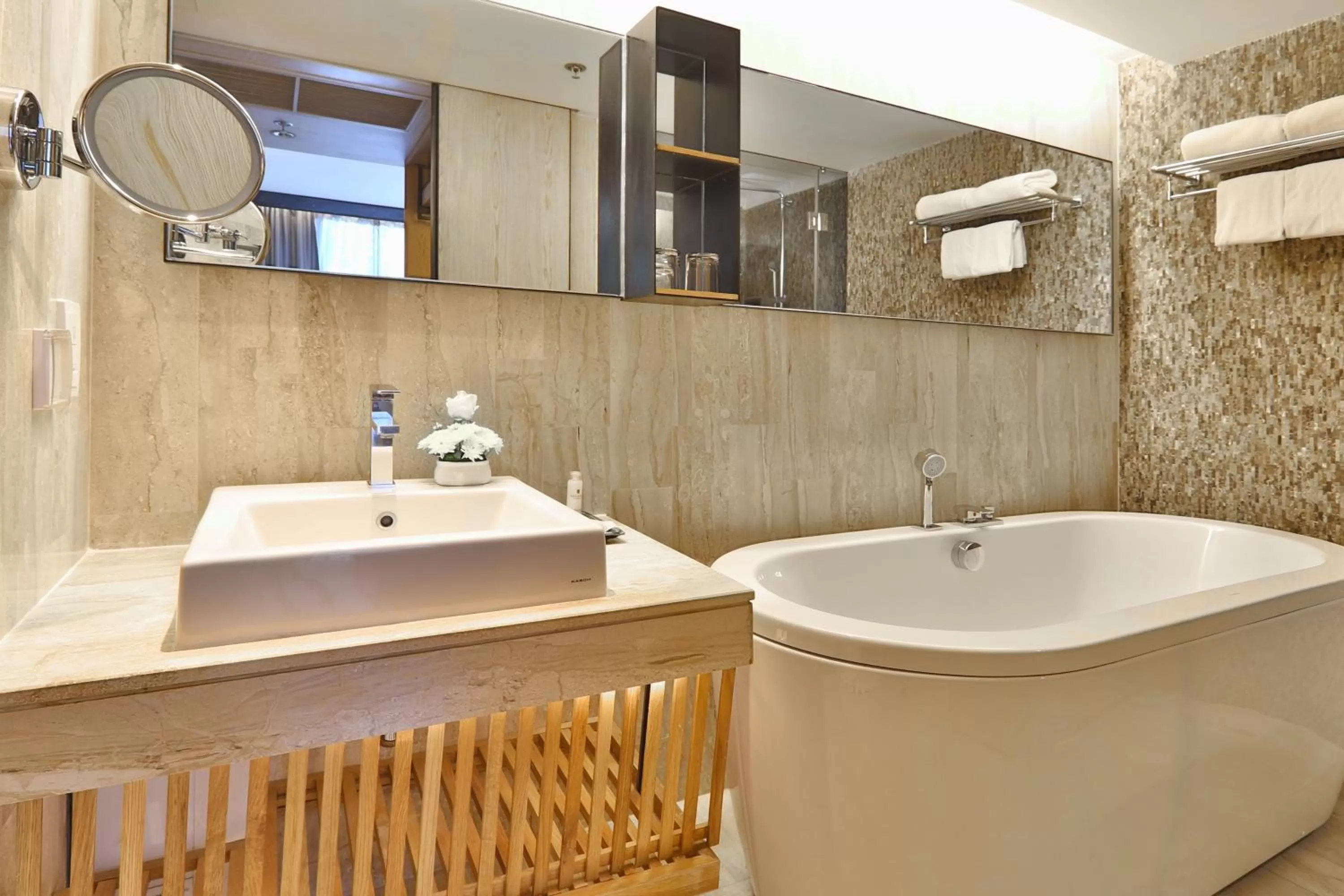 Bathroom in Arcadia Suites Bangkok