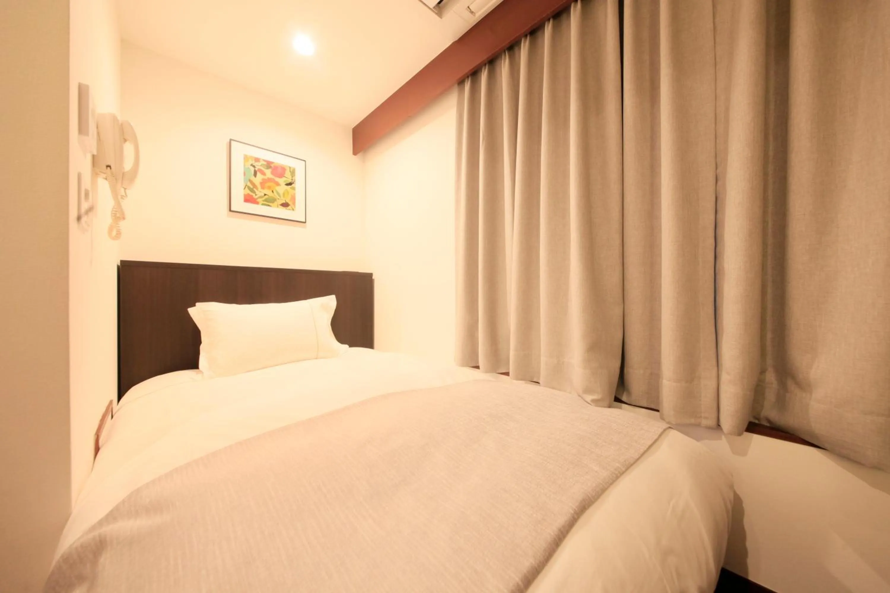 Photo of the whole room, Bed in Centurion Hotel Residential Akasaka Station