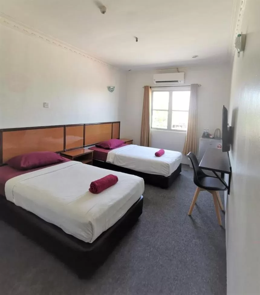 Bed in THE ZULEY HERITAGE HOTEL