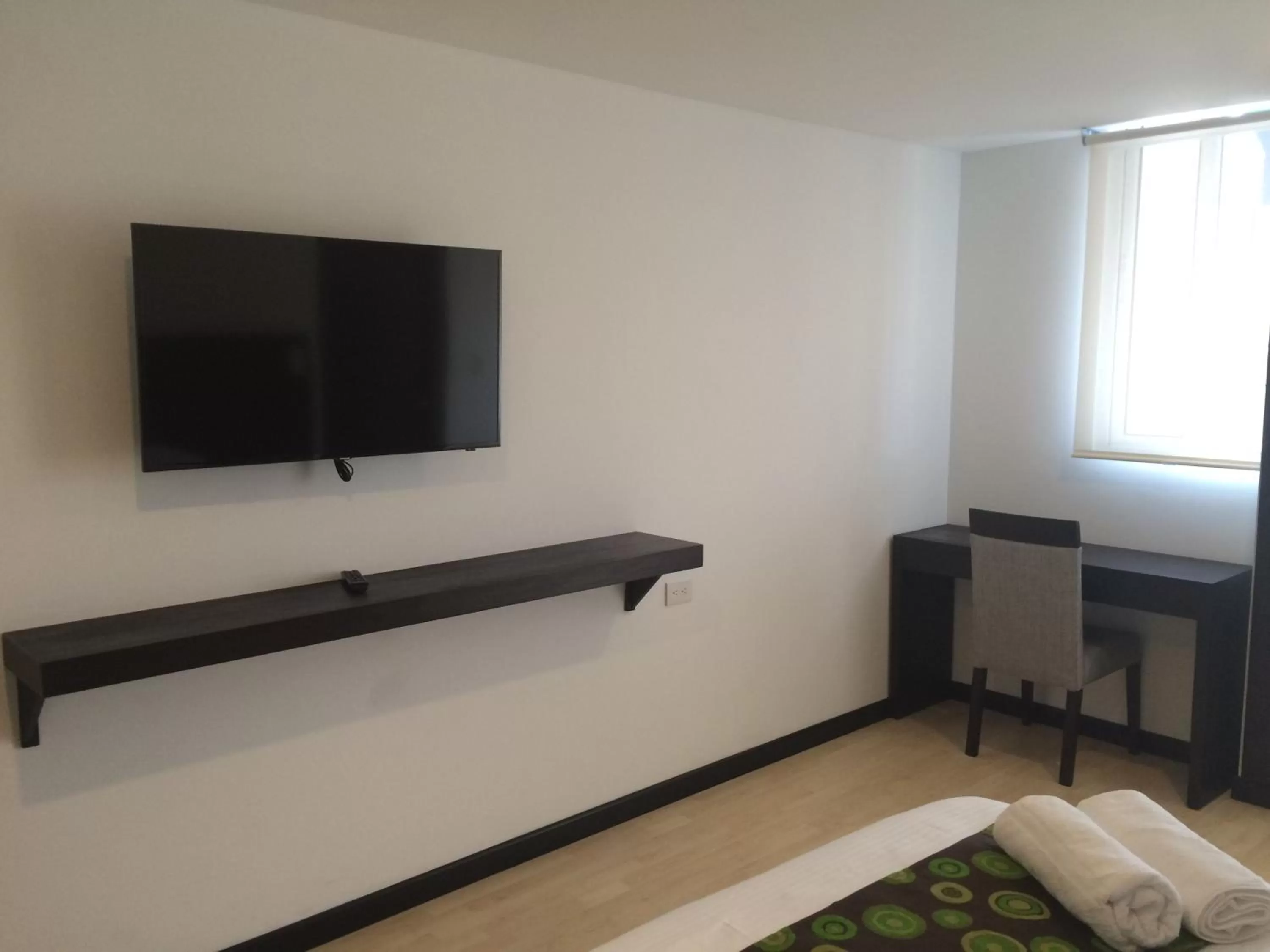 Bedroom, TV/Entertainment Center in Hotel H53