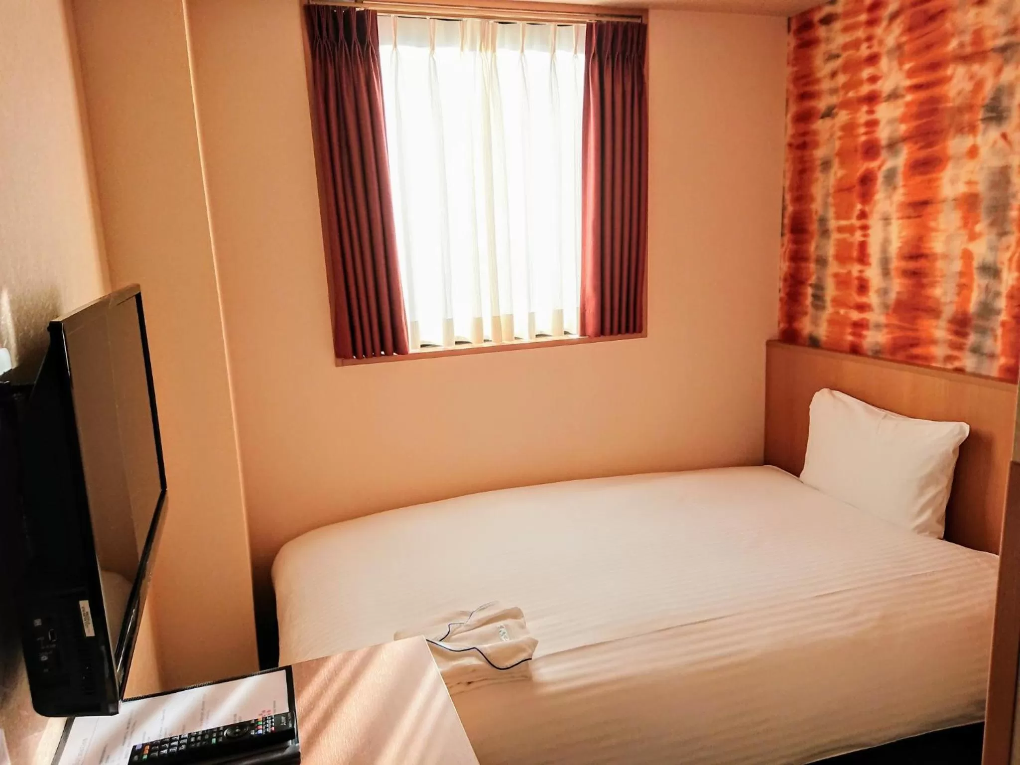 Bed in SAKURA SKY HOTEL KASHIWA(桜スカイホテル柏)