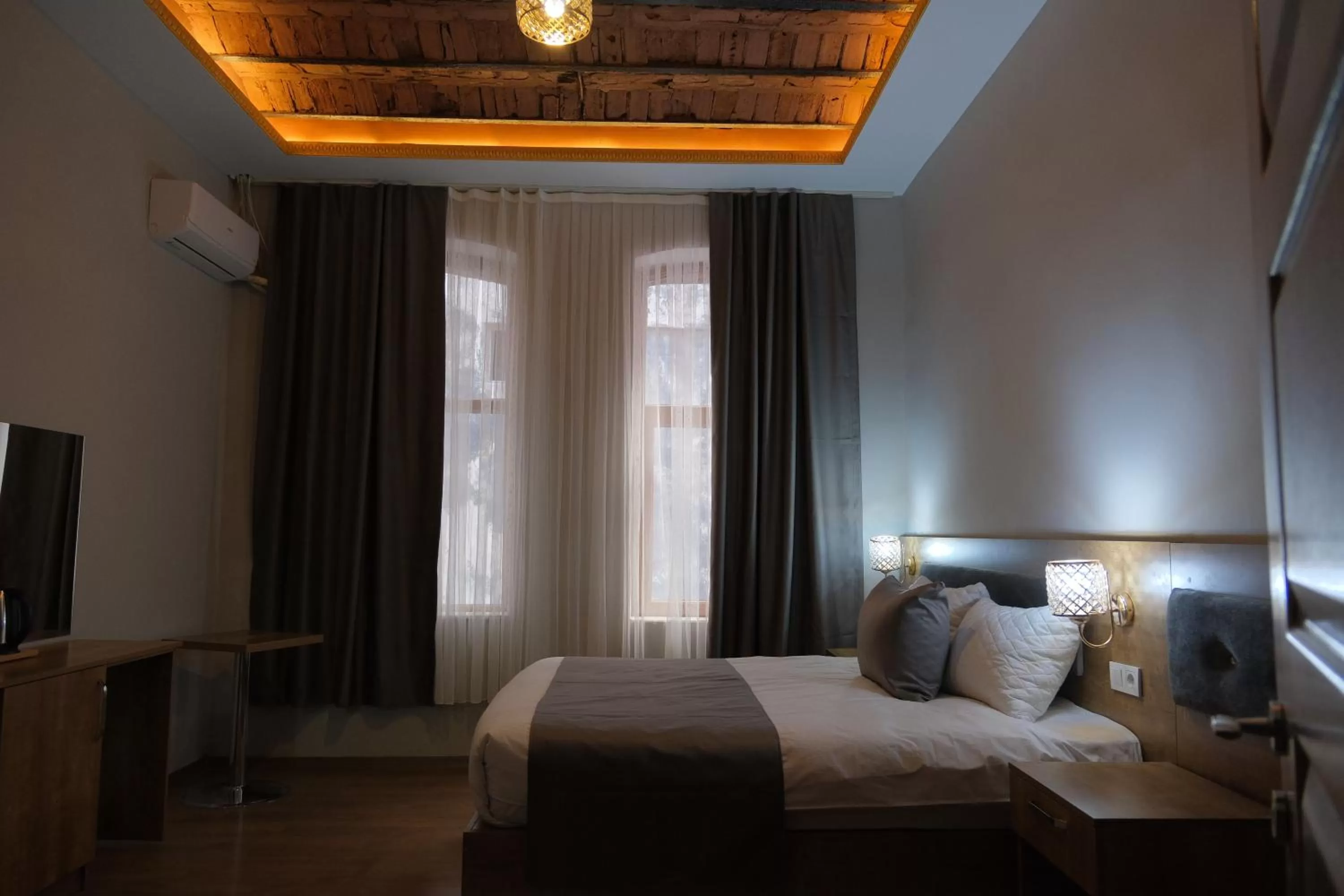 Bed in Adamantides Hotel