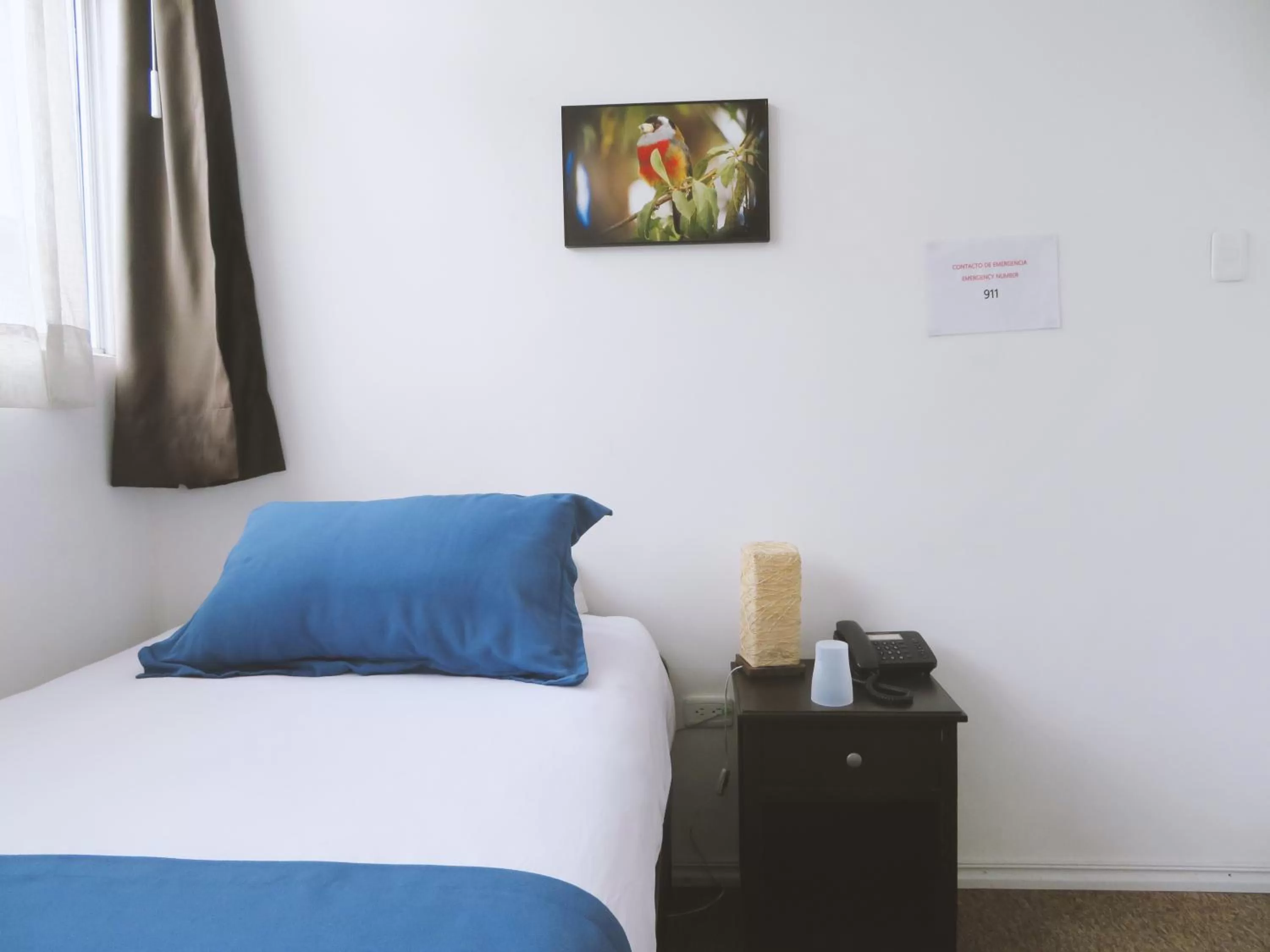 Bed in Bird Garden Guest House