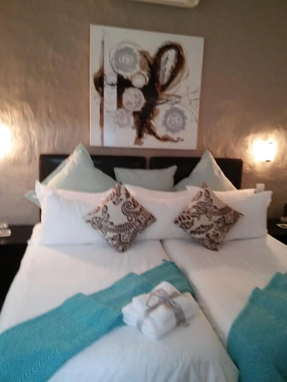 Bed in Point B Guest House -Sustainable Solar Energy