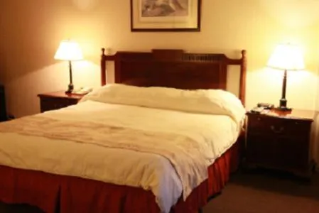 Bed in Caravelle Inn & Suites