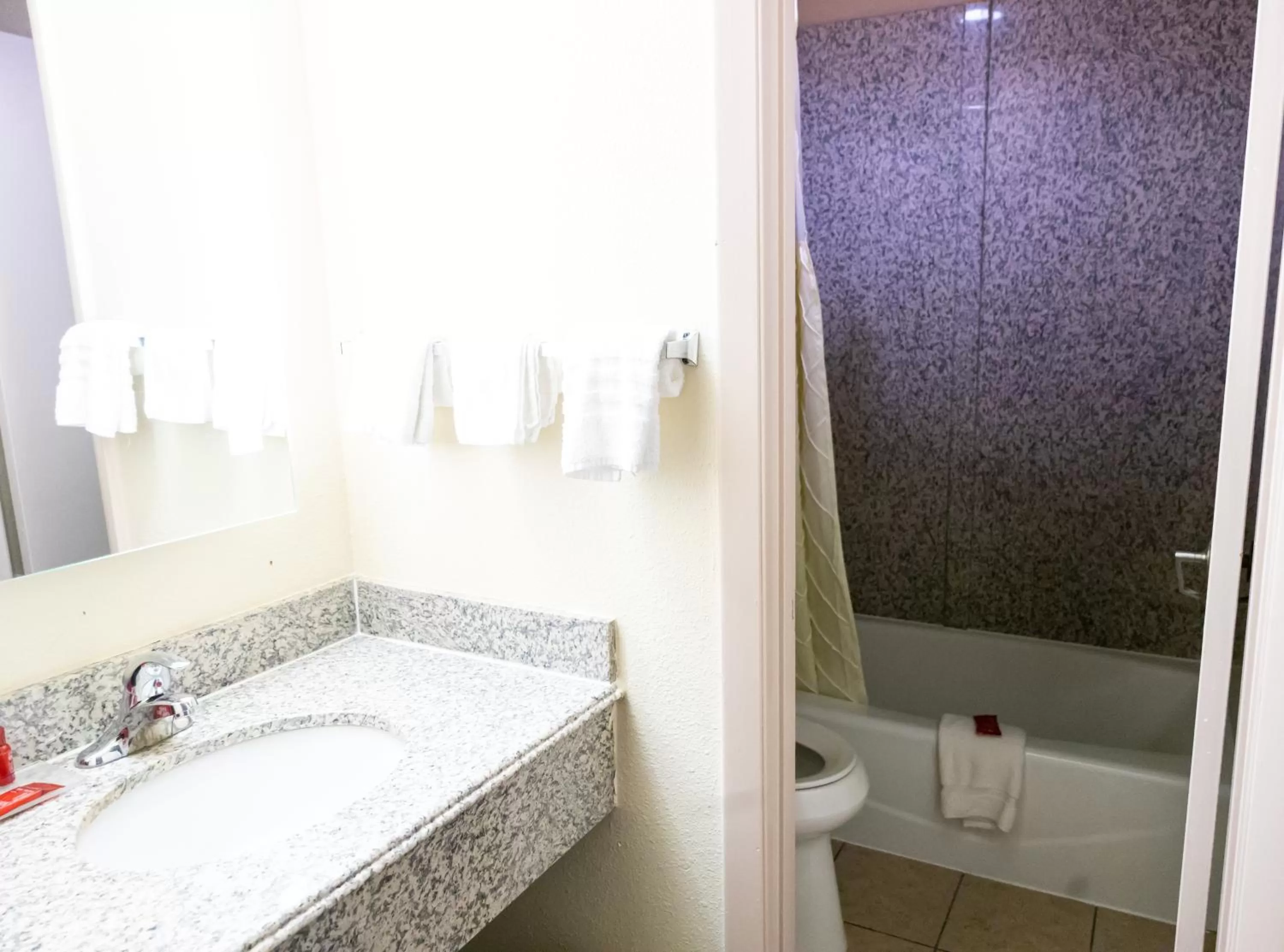 Bathroom in Days Inn by Wyndham College Park Atlanta Airport South