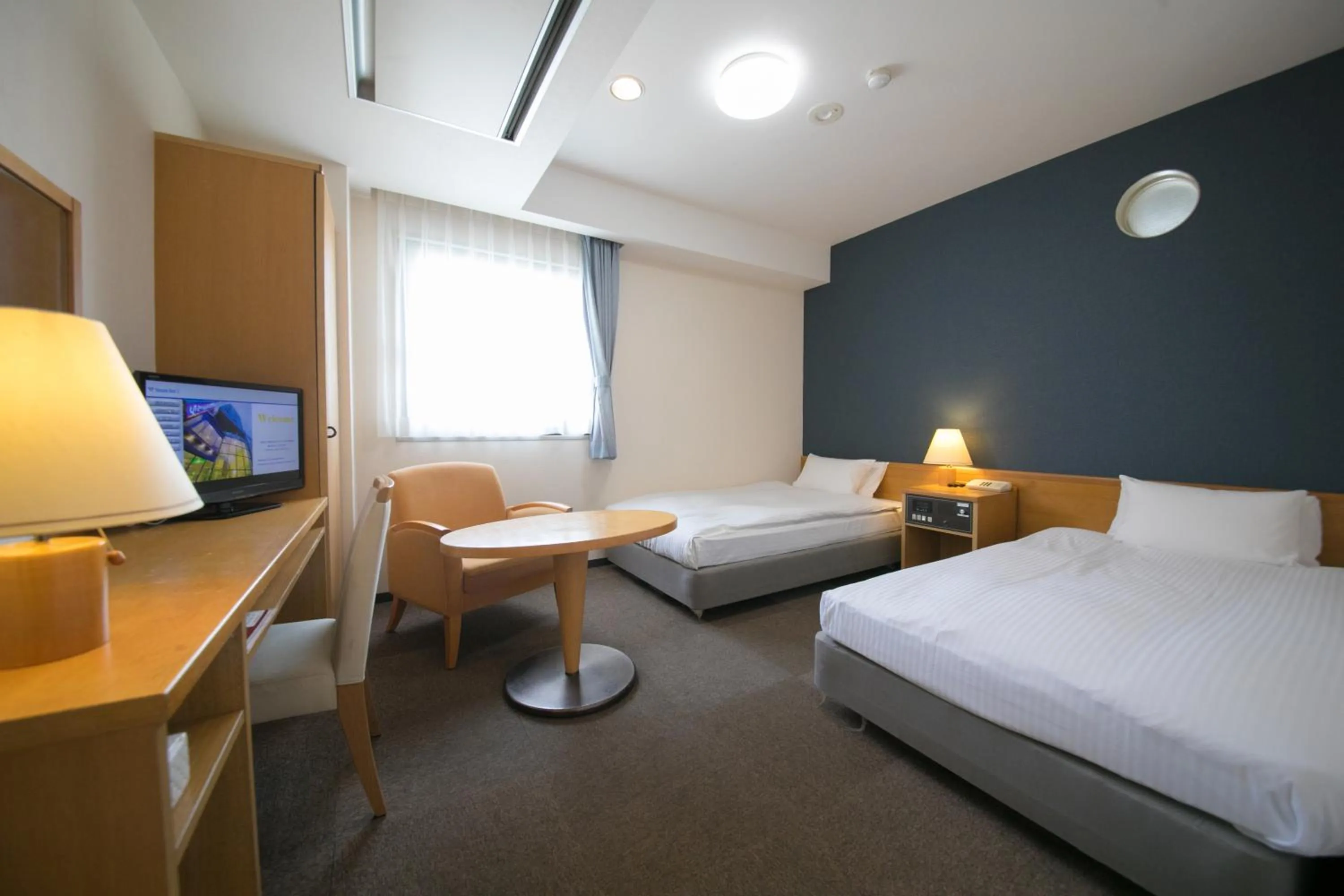 Bed in Heiwadai Hotel 5