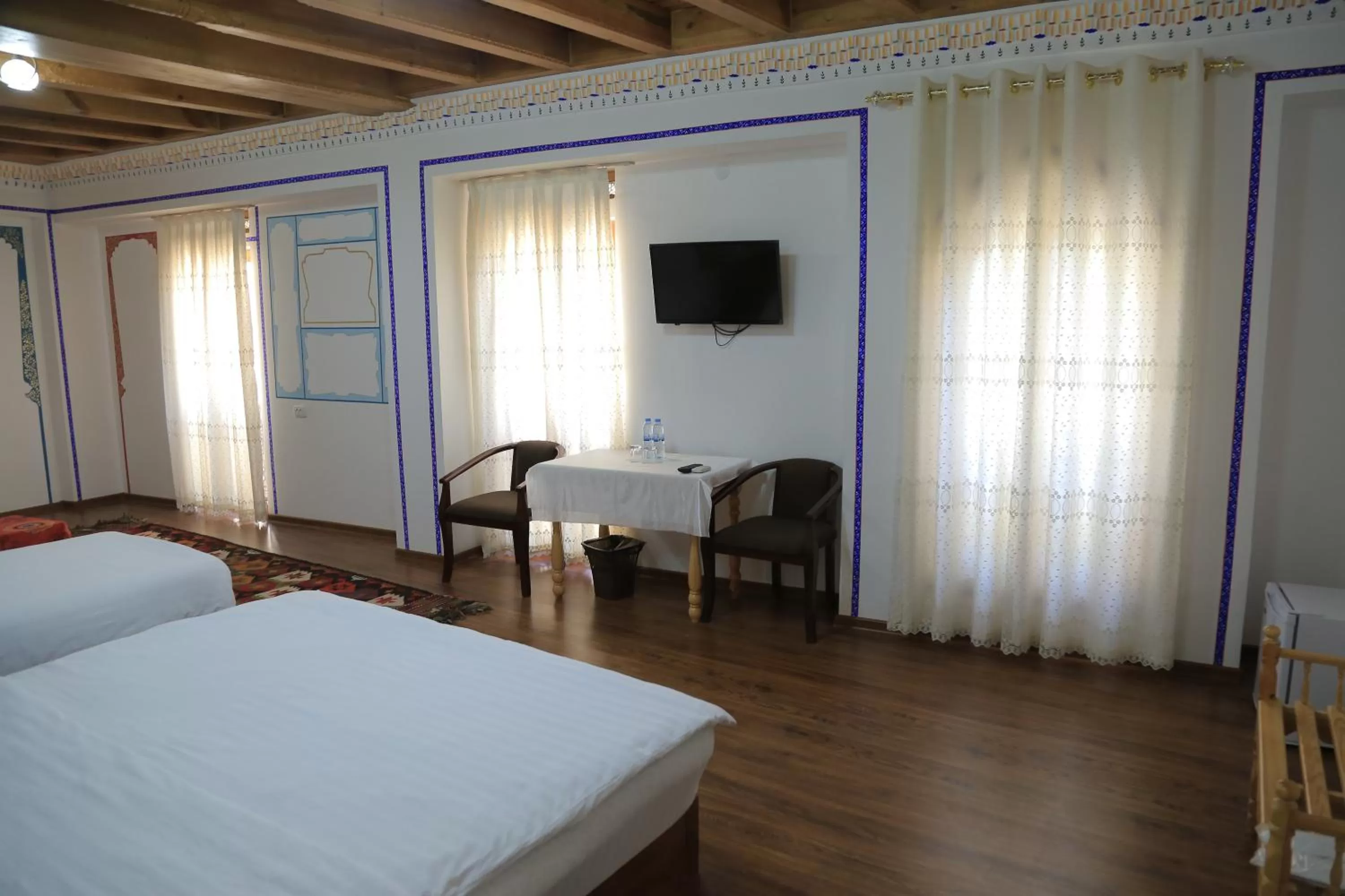 Bed, TV/Entertainment Center in As-Salam Boutique Hotel