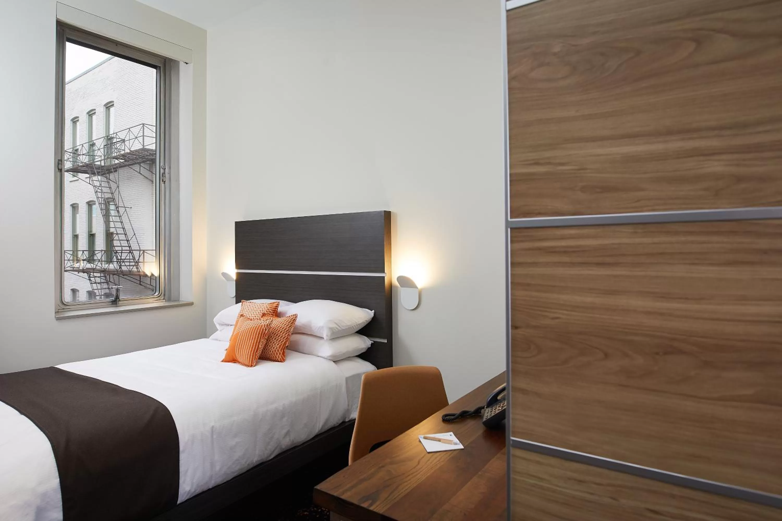 Bed in CityFlatsHotel - Grand Rapids, an Ascend Collection Hotel