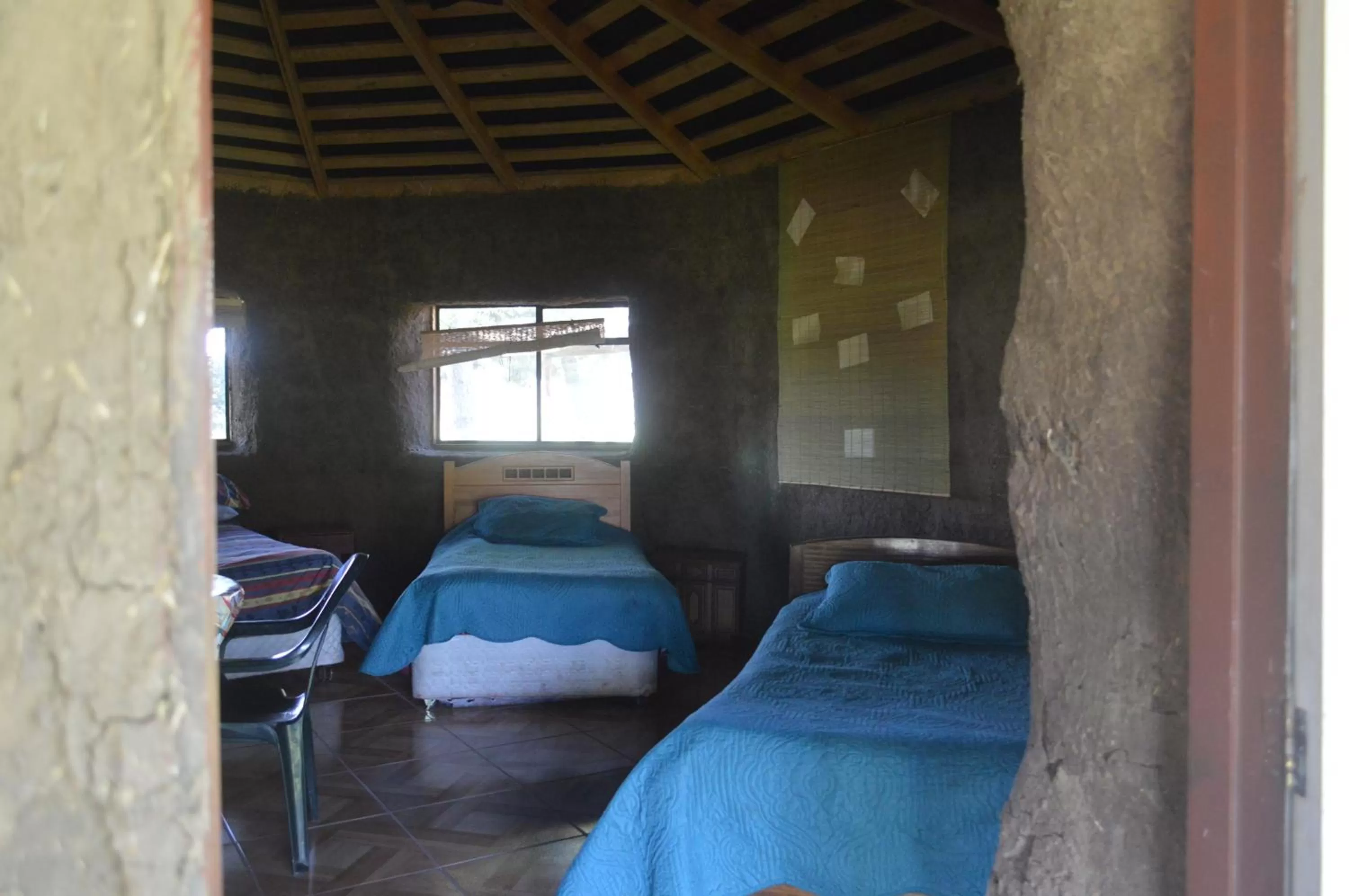 Bed in Coyunche Cabañas y Camping Laja & San Rosendo