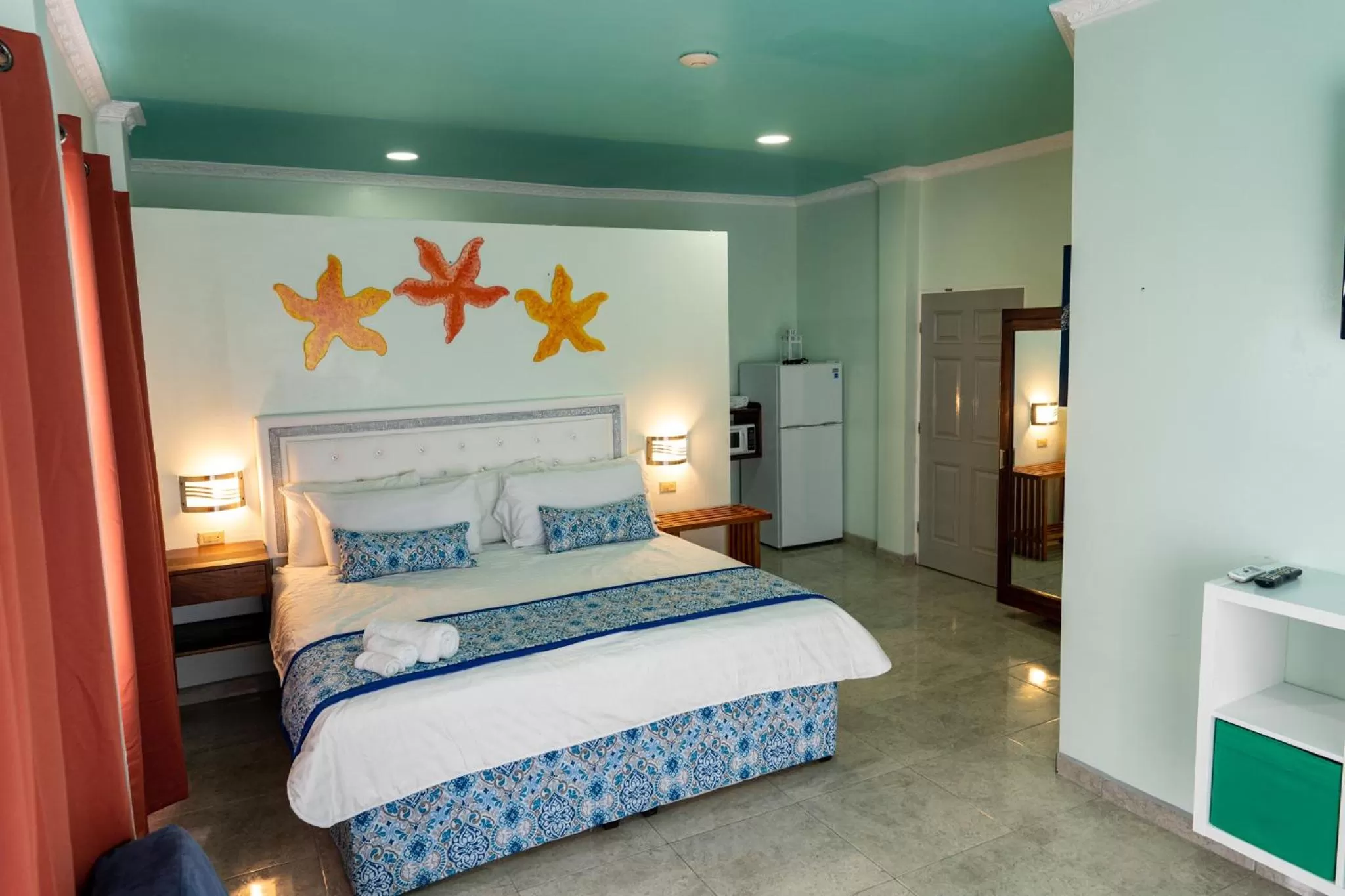 Photo of the whole room, Bed in Island Magic Beach Resort